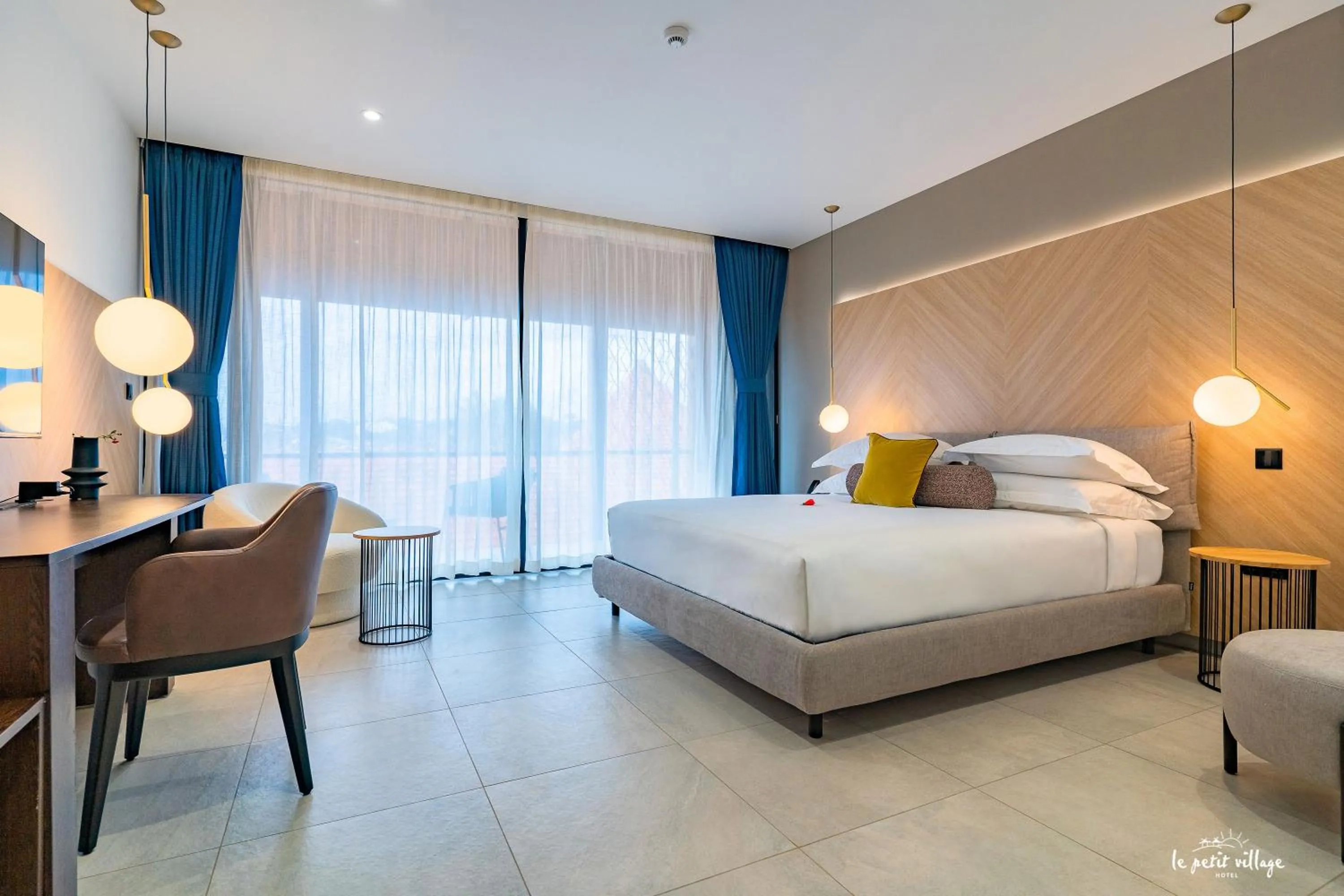 Bed in Le Petit Village Boutique Hotel & Spa