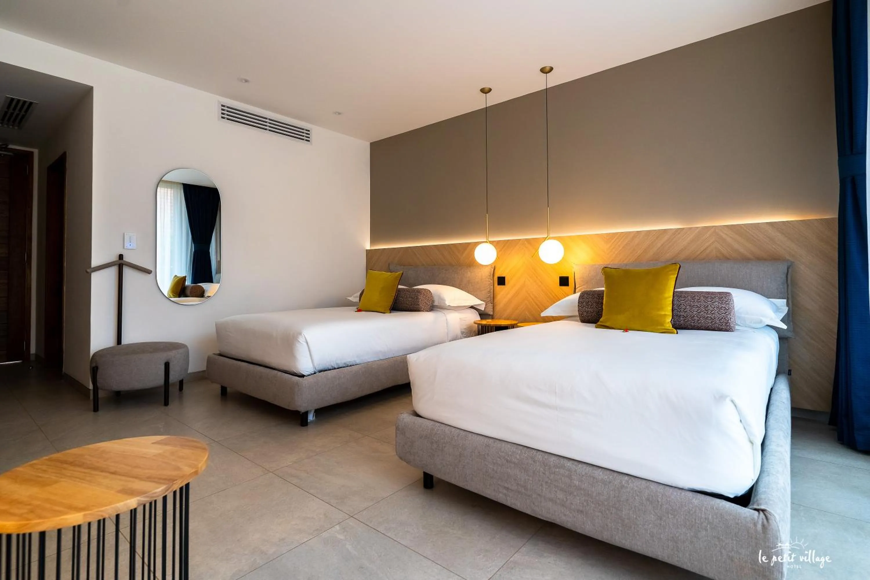 Bed in Le Petit Village Boutique Hotel & Spa