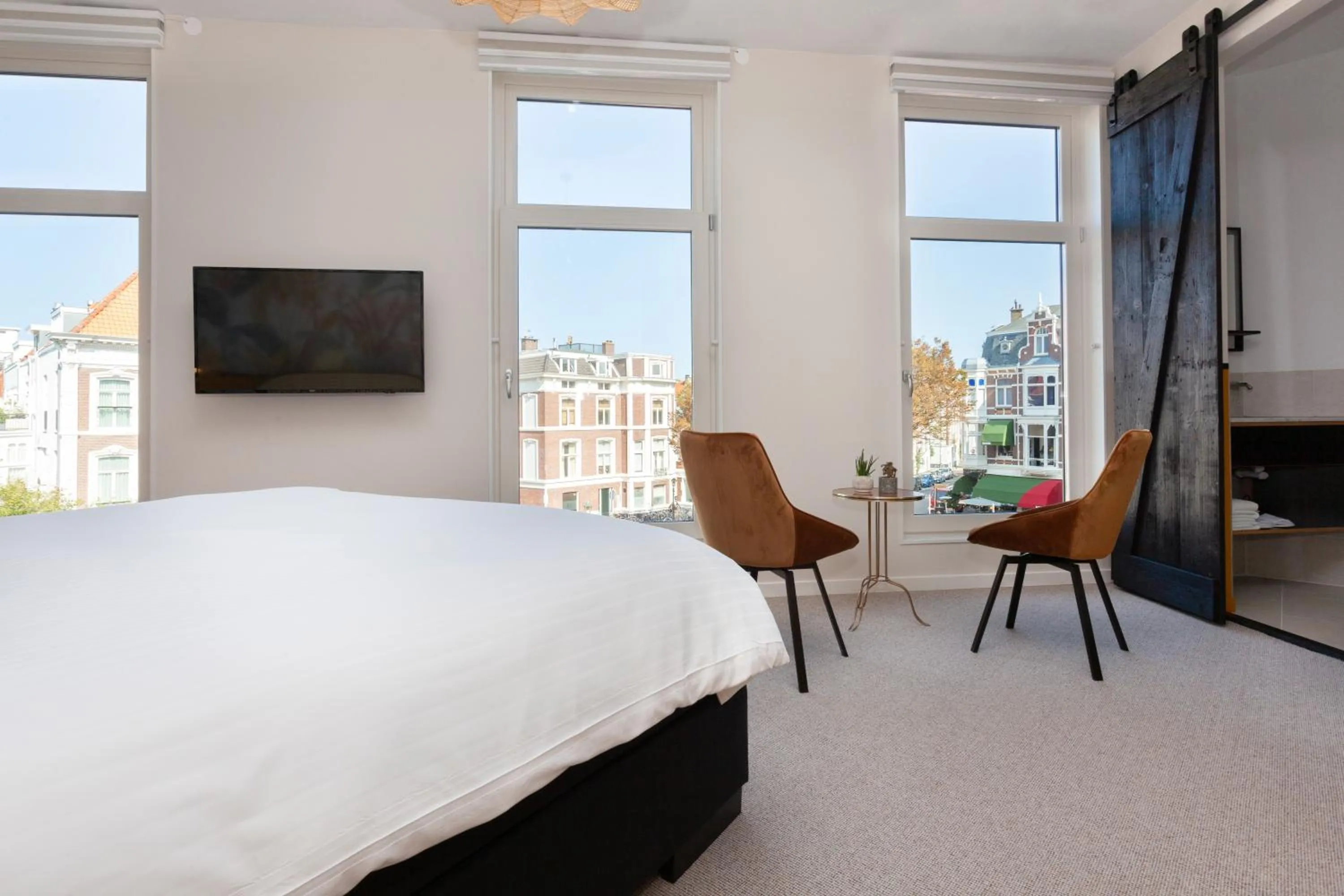 Seating area, Bed in La Paulowna Boutique Hotel