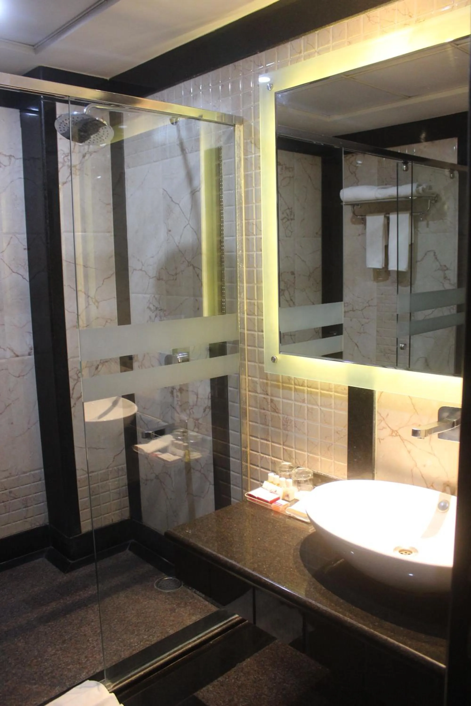 Bathroom in Ramada by Wyndham Varanasi Katesar