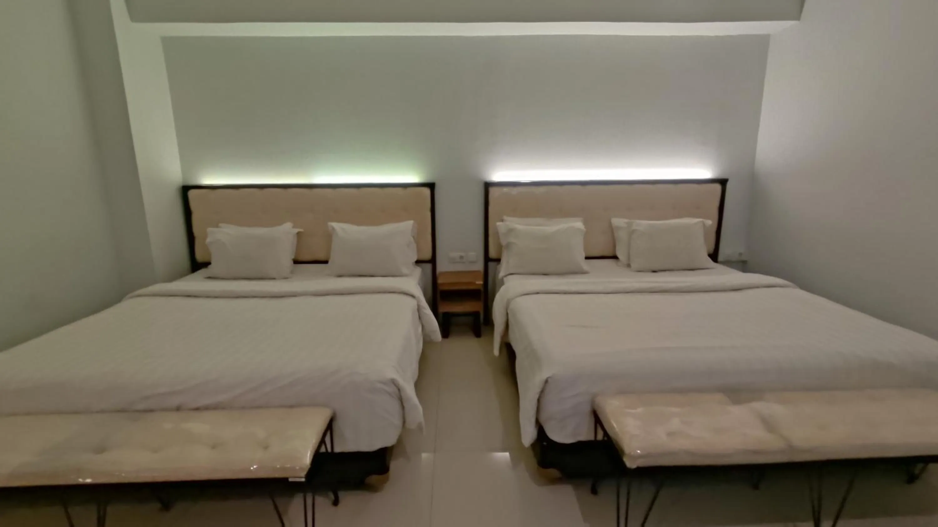 Bed in De La Charis Hotel by Waringin Hospitality