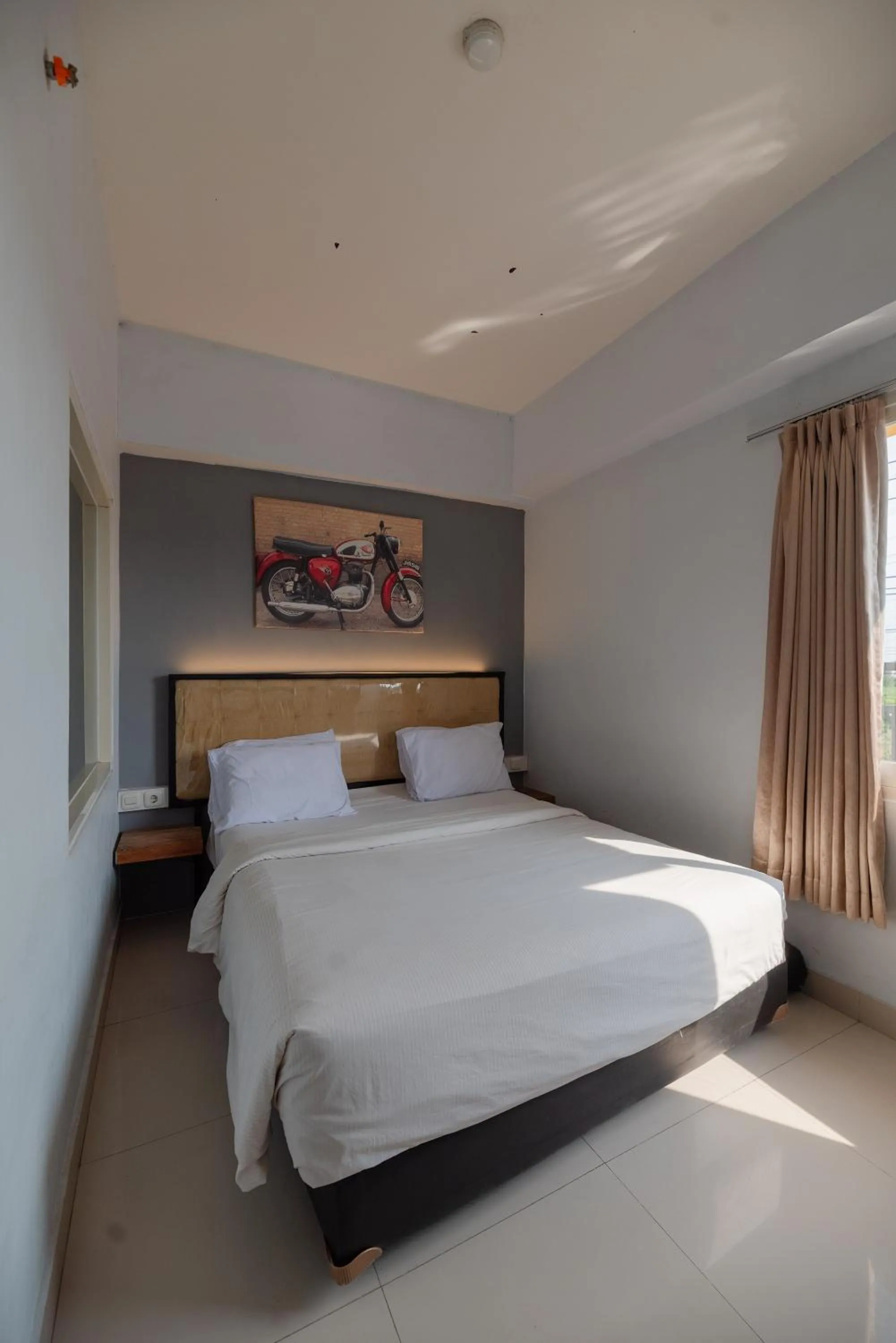 Bed in De La Charis Hotel by Waringin Hospitality