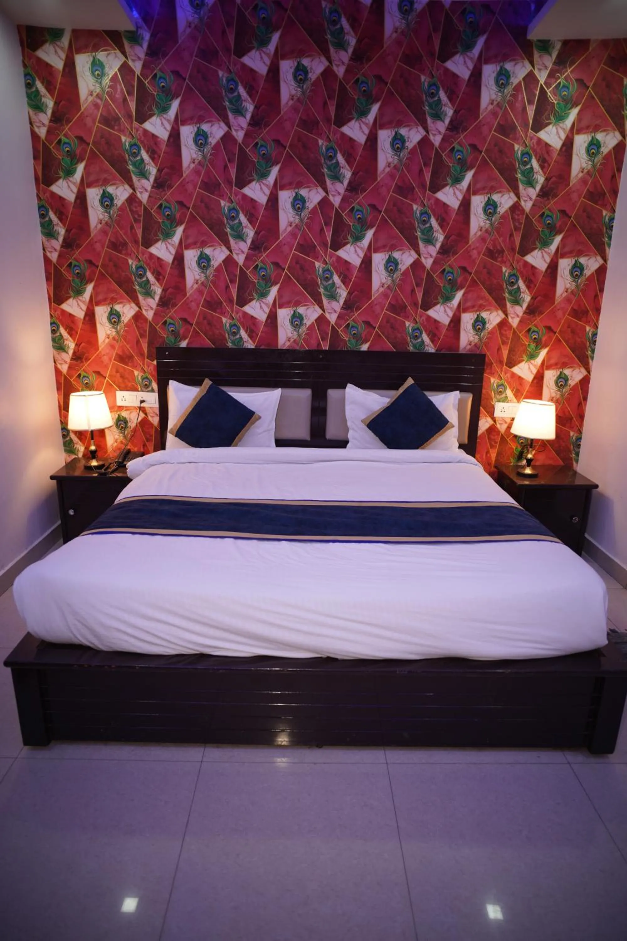 Bed in Blue Sky Hotels and Banquet