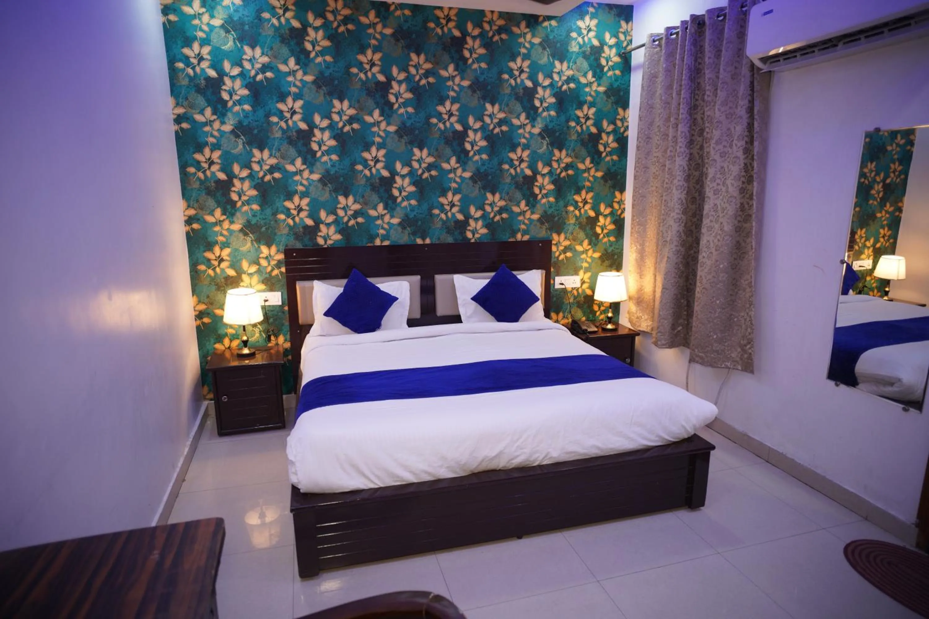 Bed in Blue Sky Hotels and Banquet