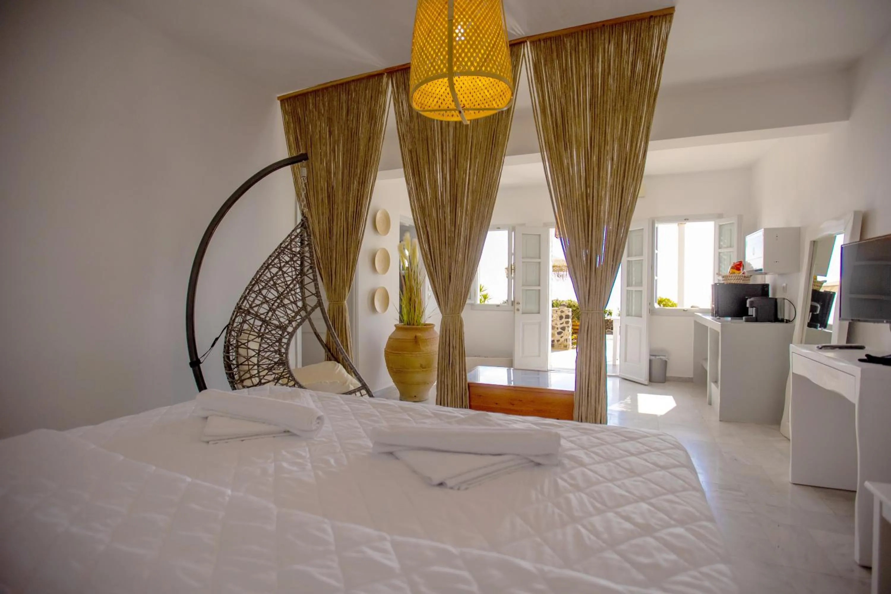 Bed in Phaos Santorini Suites