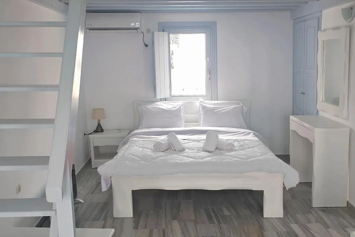 Bed in Phaos Santorini Suites