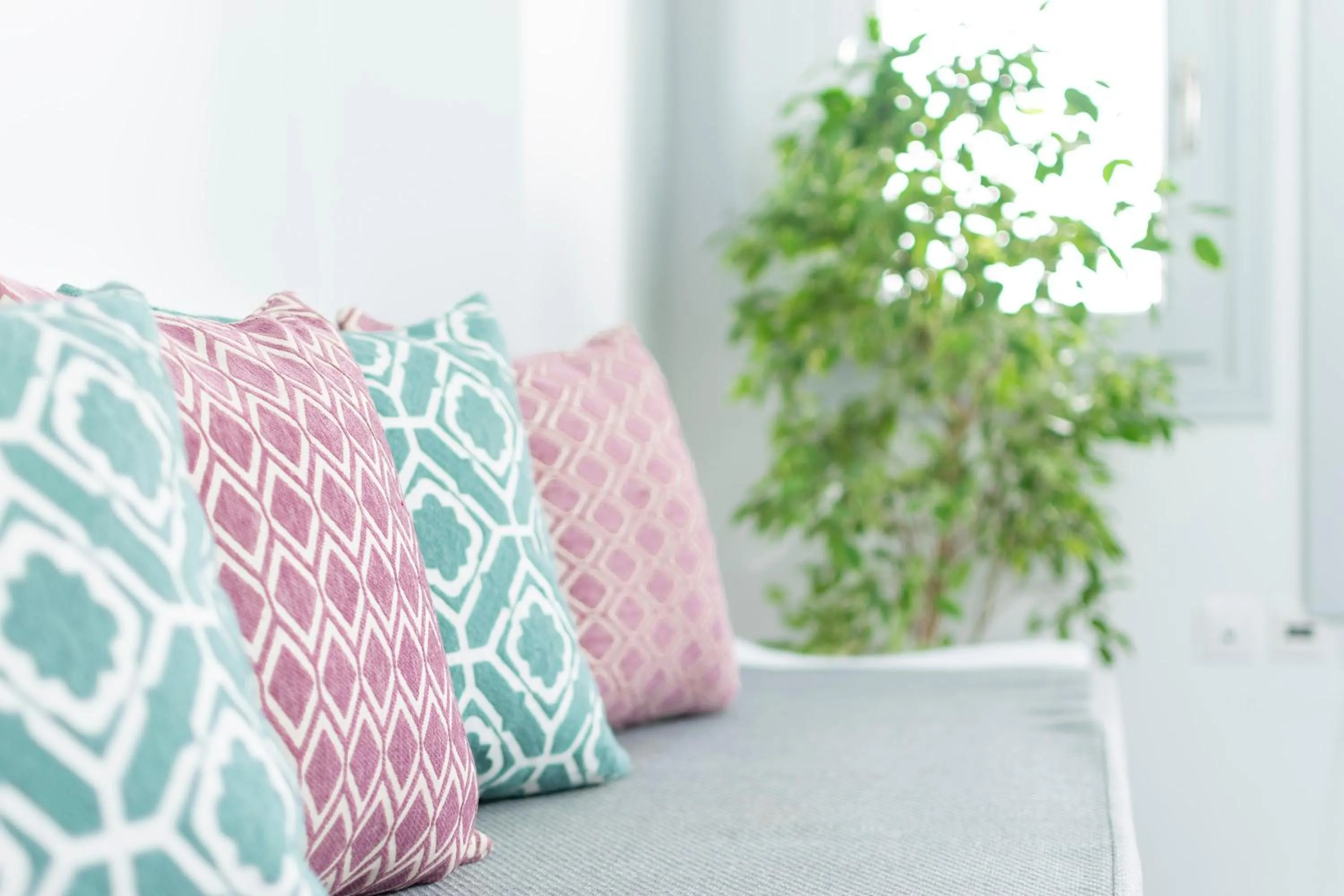 Seating area, Bed in Phaos Santorini Suites