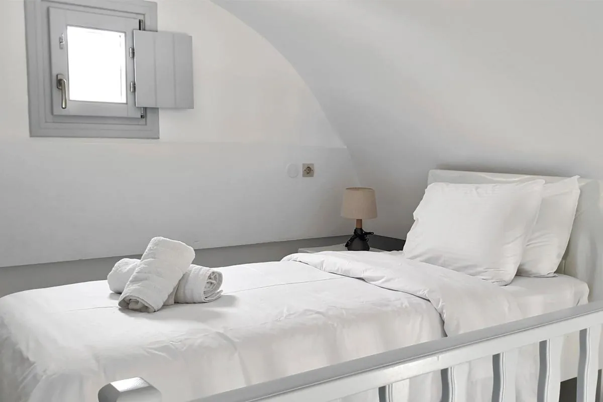 Bed in Phaos Santorini Suites