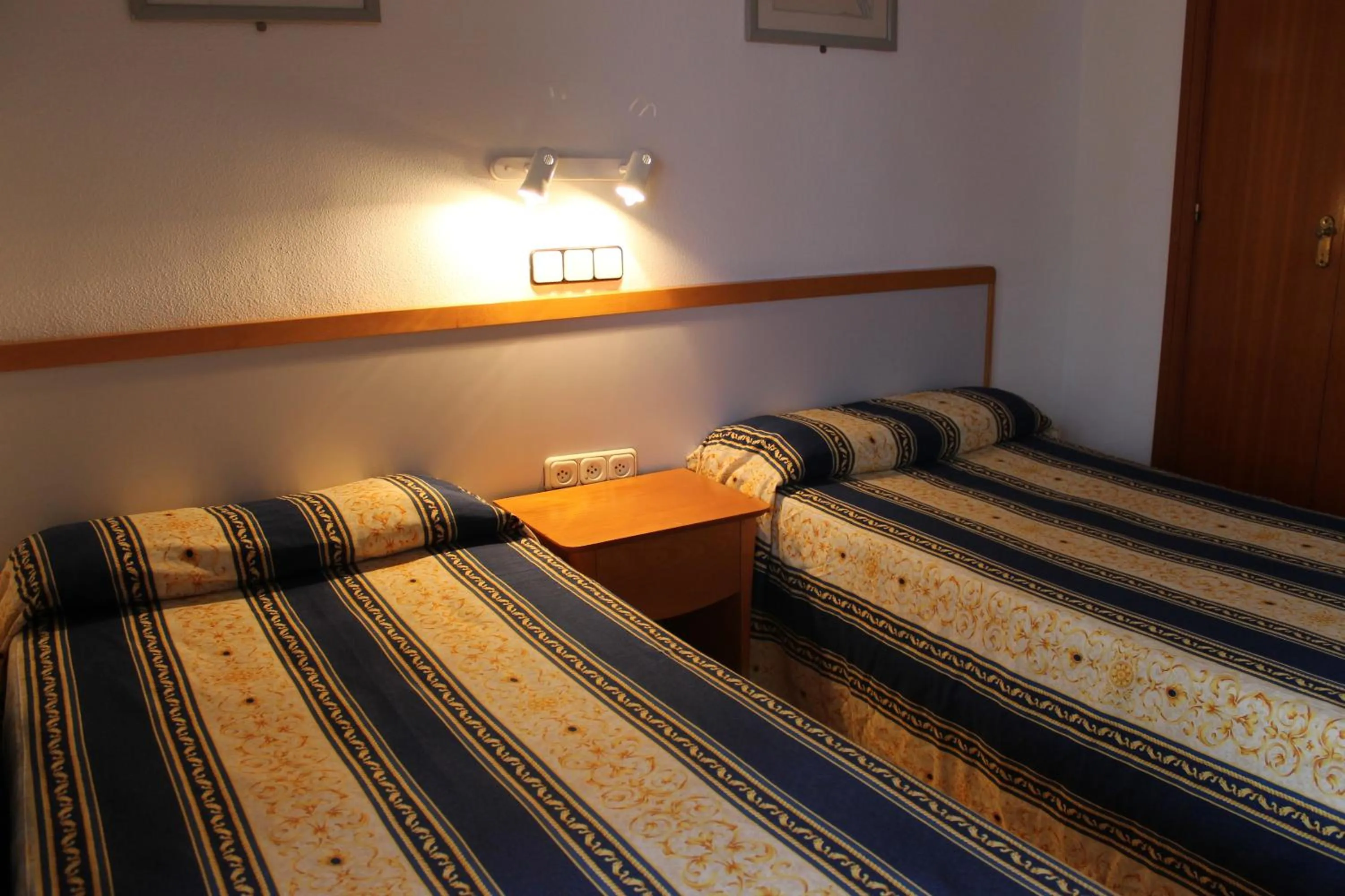 Bed in Apartamentos Alpha