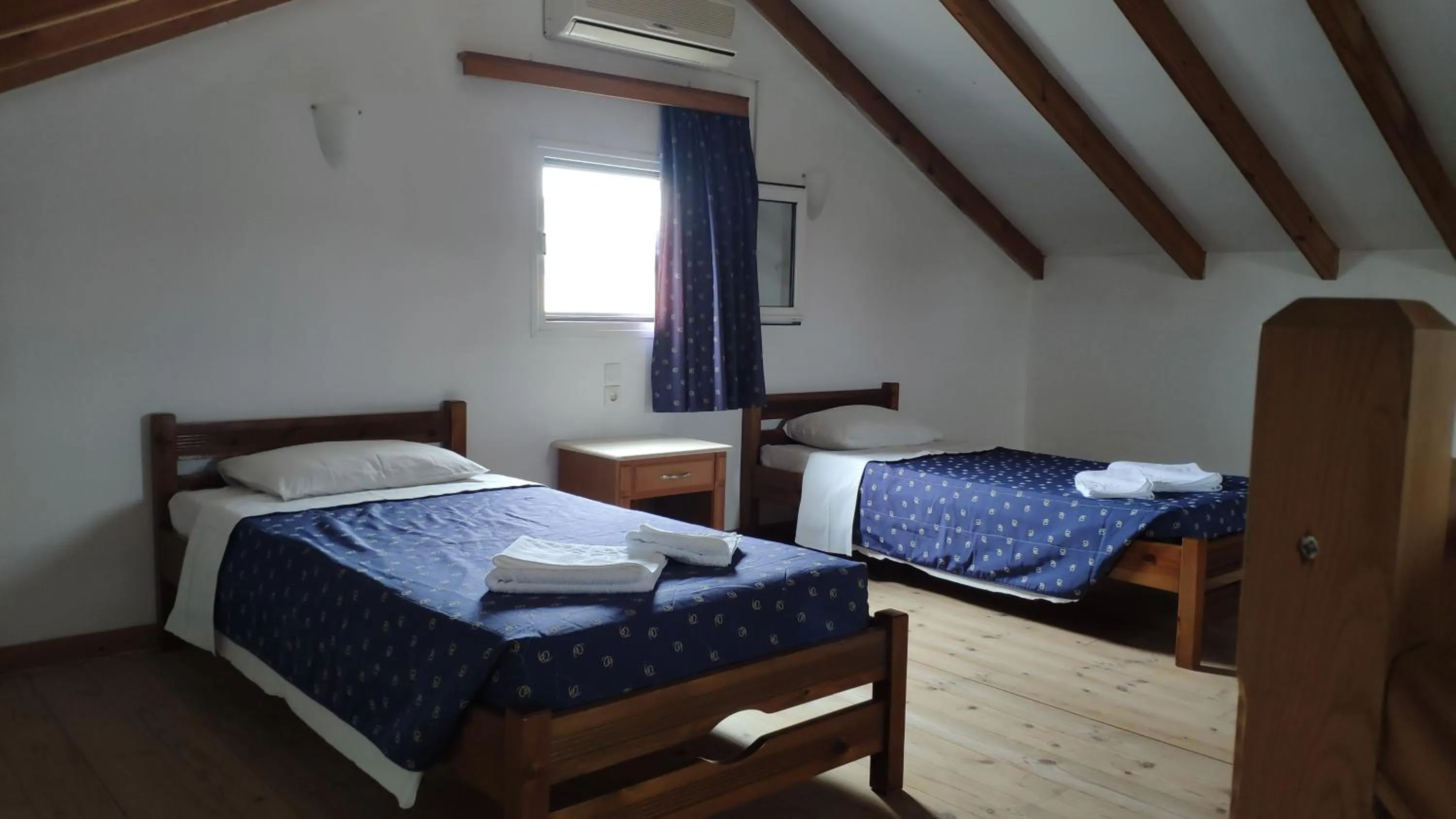 Bed in Tondoris Apartments