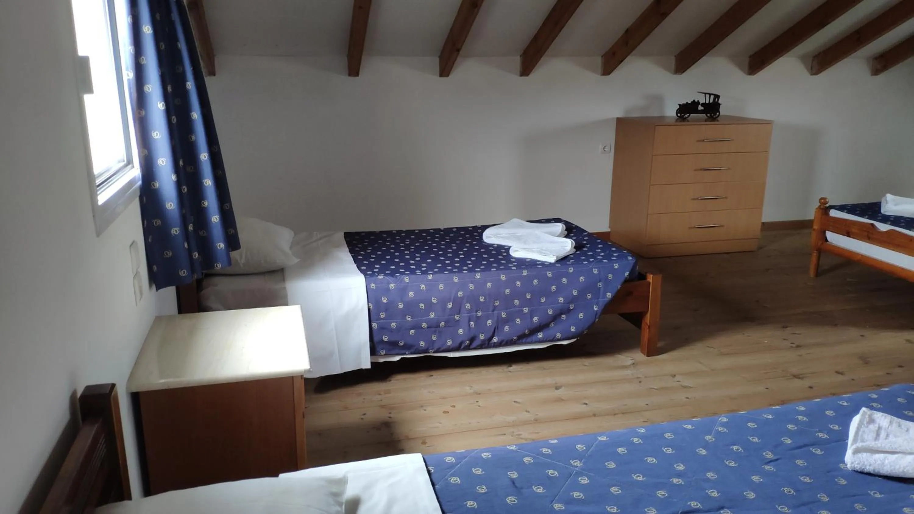 Bed in Tondoris Apartments