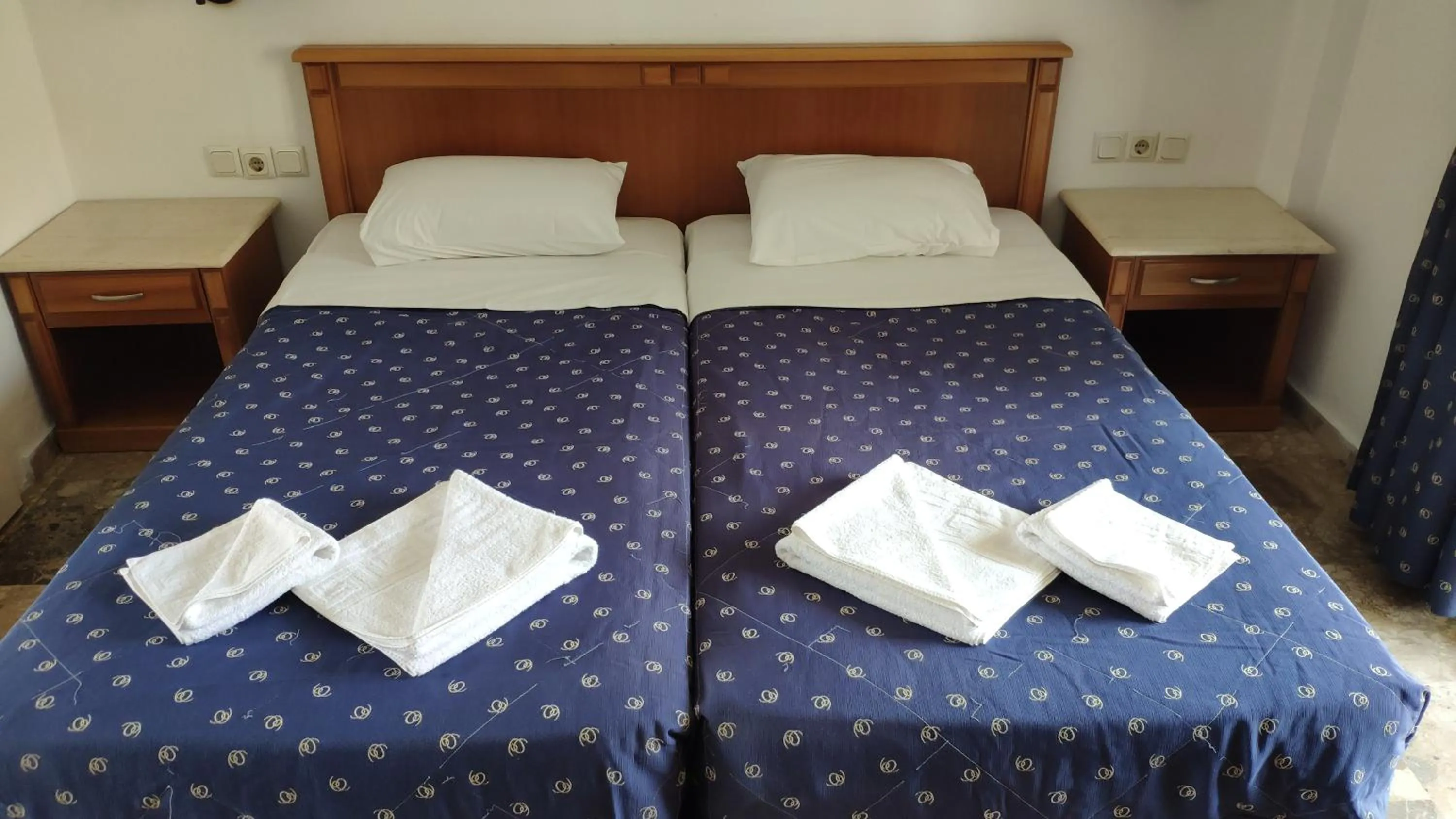 Bed in Tondoris Apartments