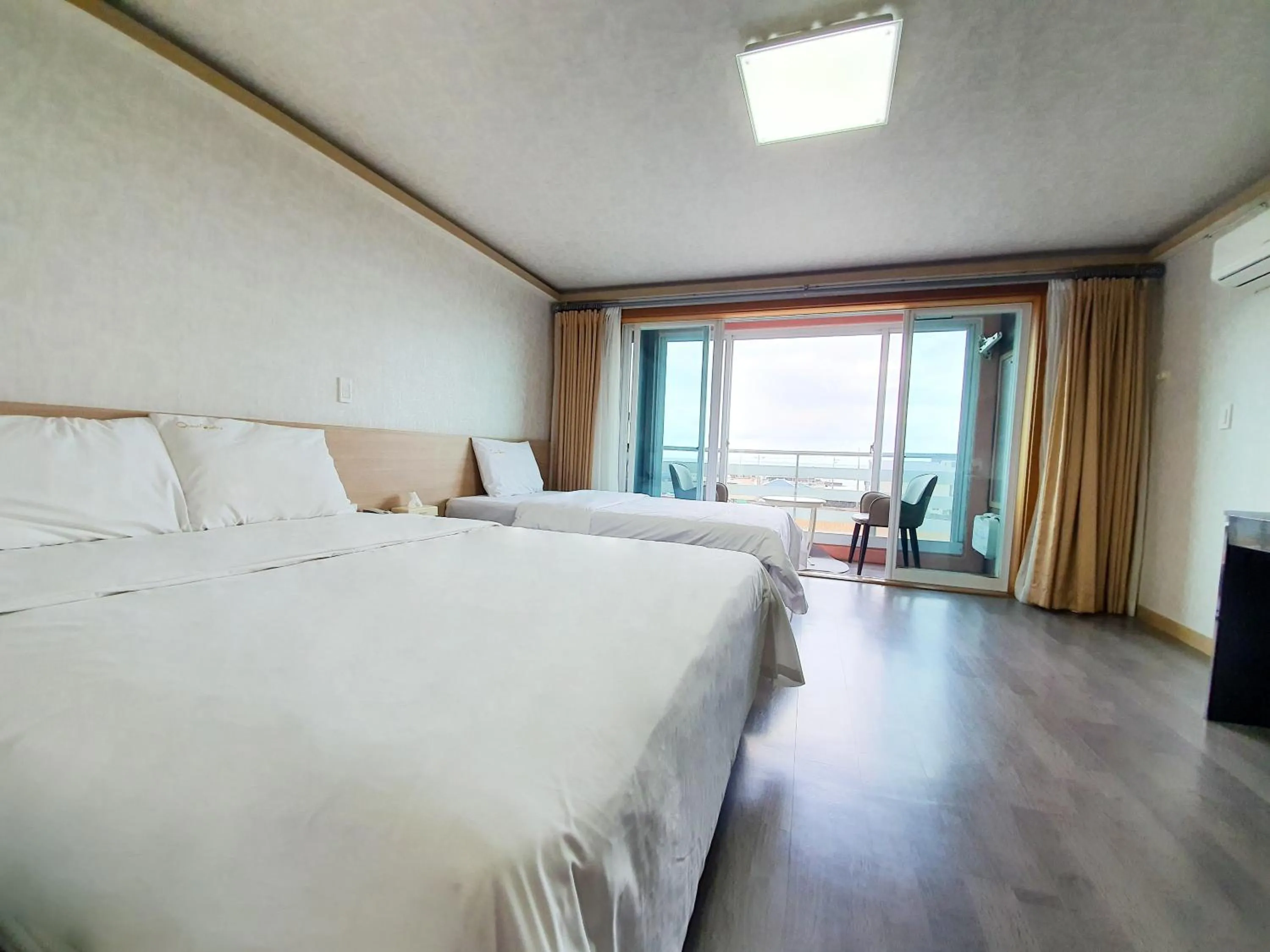 Bed in Jeju Ocean Family Hotel