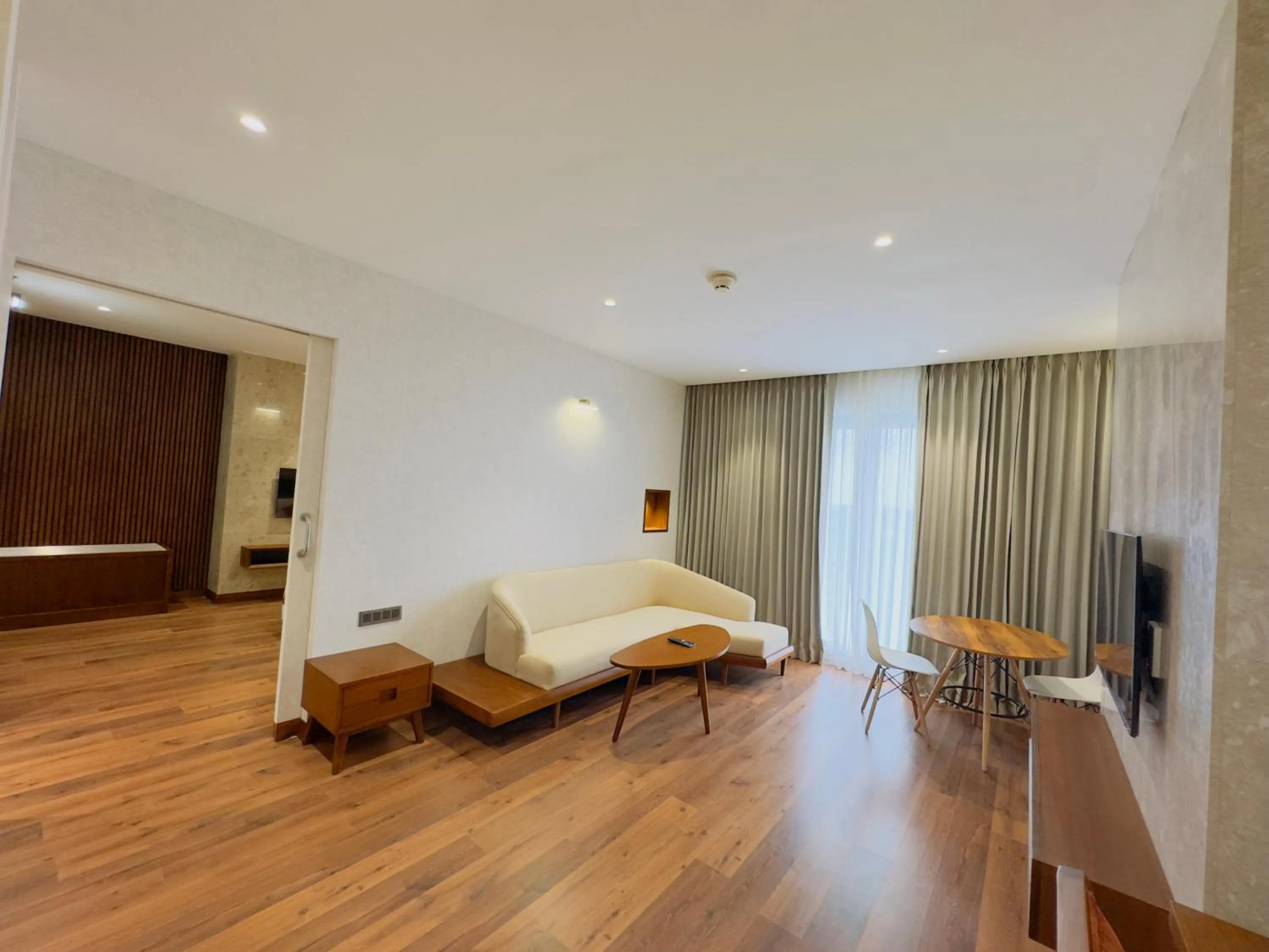 Living room, Bed in Gokulam Grand Kozhikode