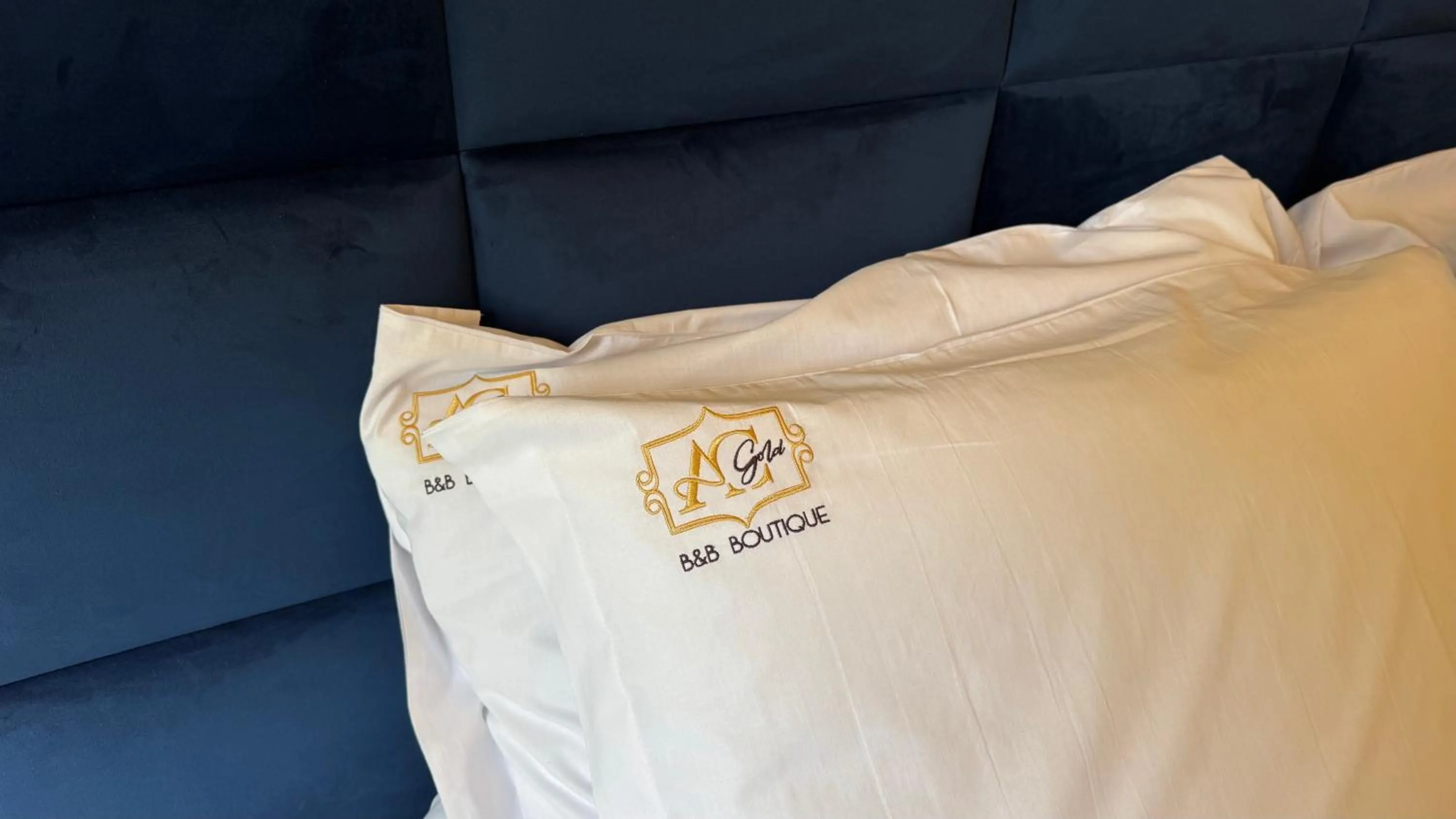 Bed in AC GOLD B&B Boutique Rooms & Suite