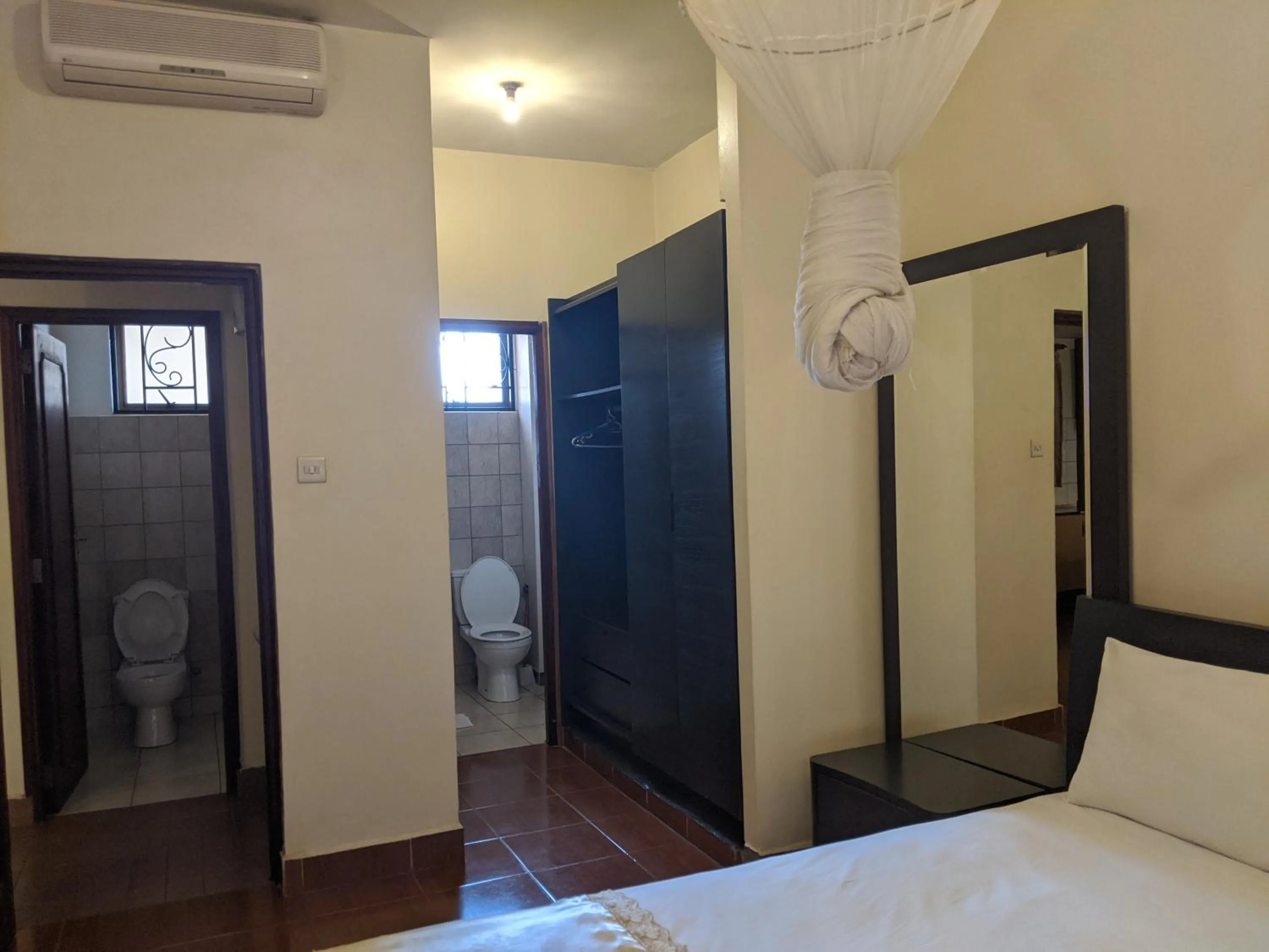 Bed in Prestige Hotel Suites