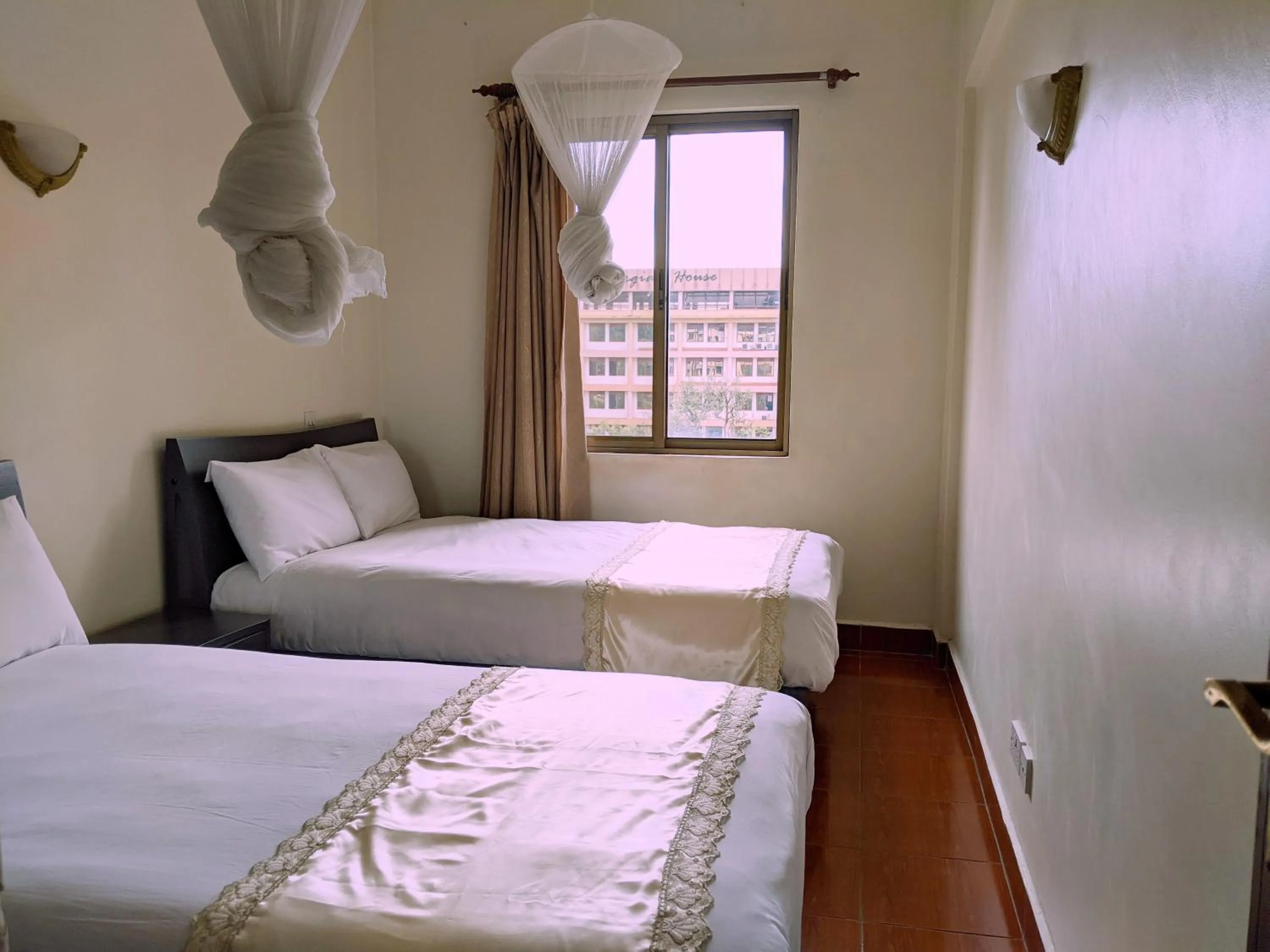 Bed in Prestige Hotel Suites