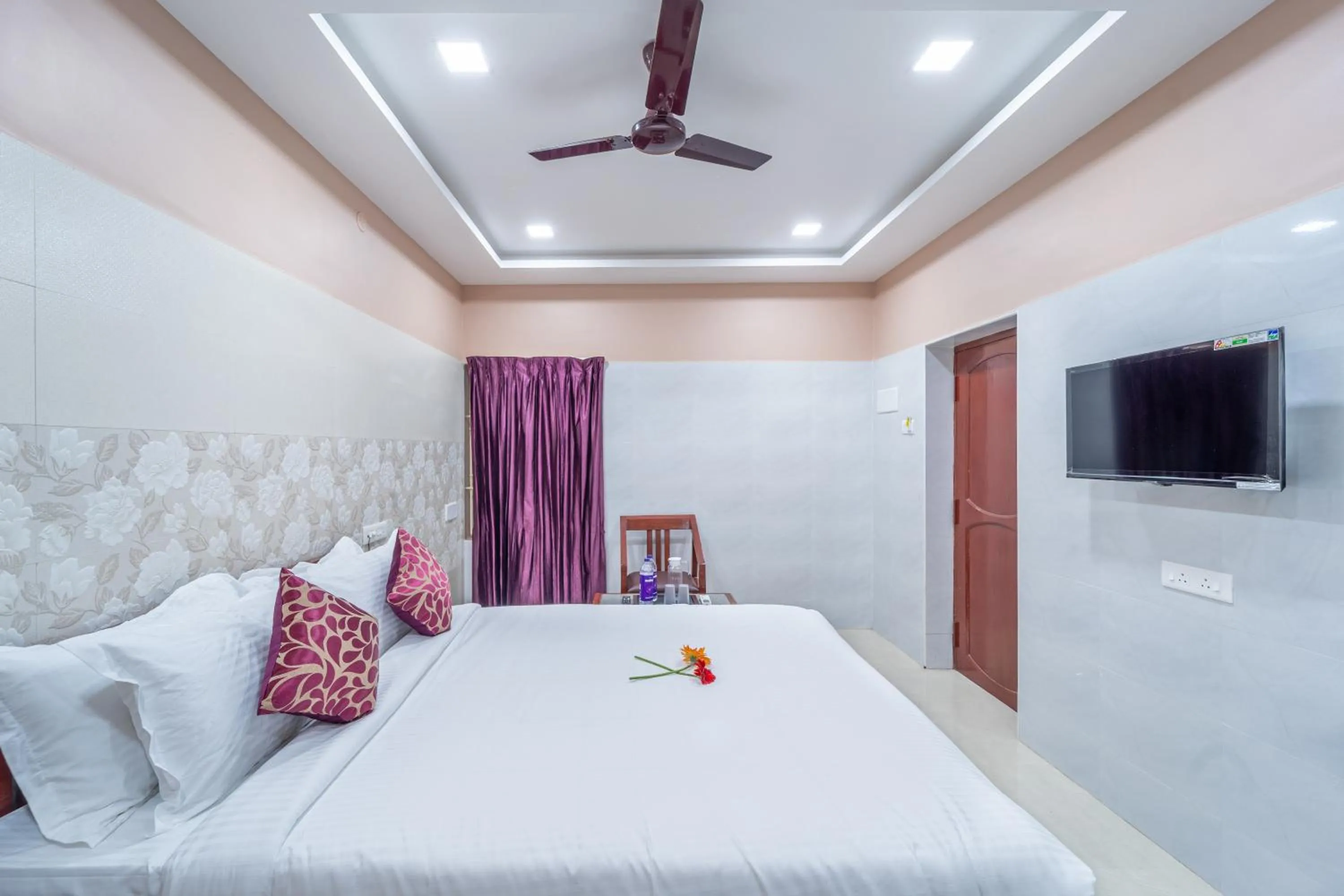 Photo of the whole room, Bed in Sam Residency
