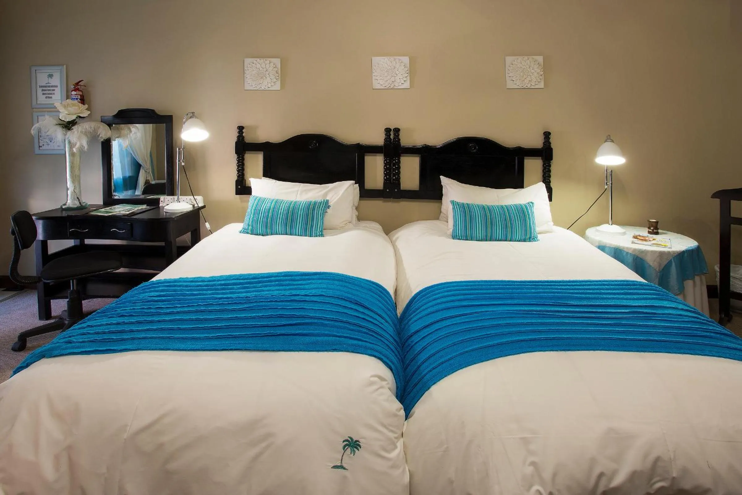 Bed in The Royal Palm B&B