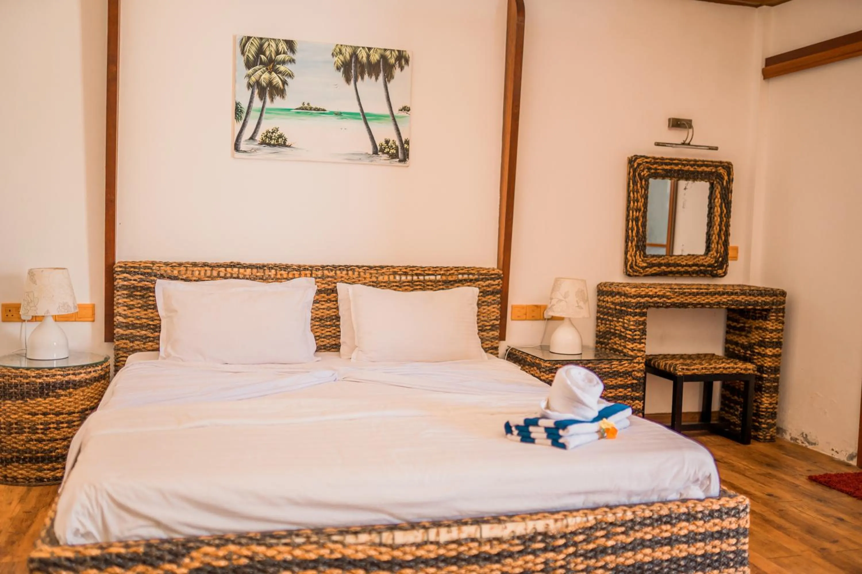 Bedroom in Long Beach Laamu Hotel