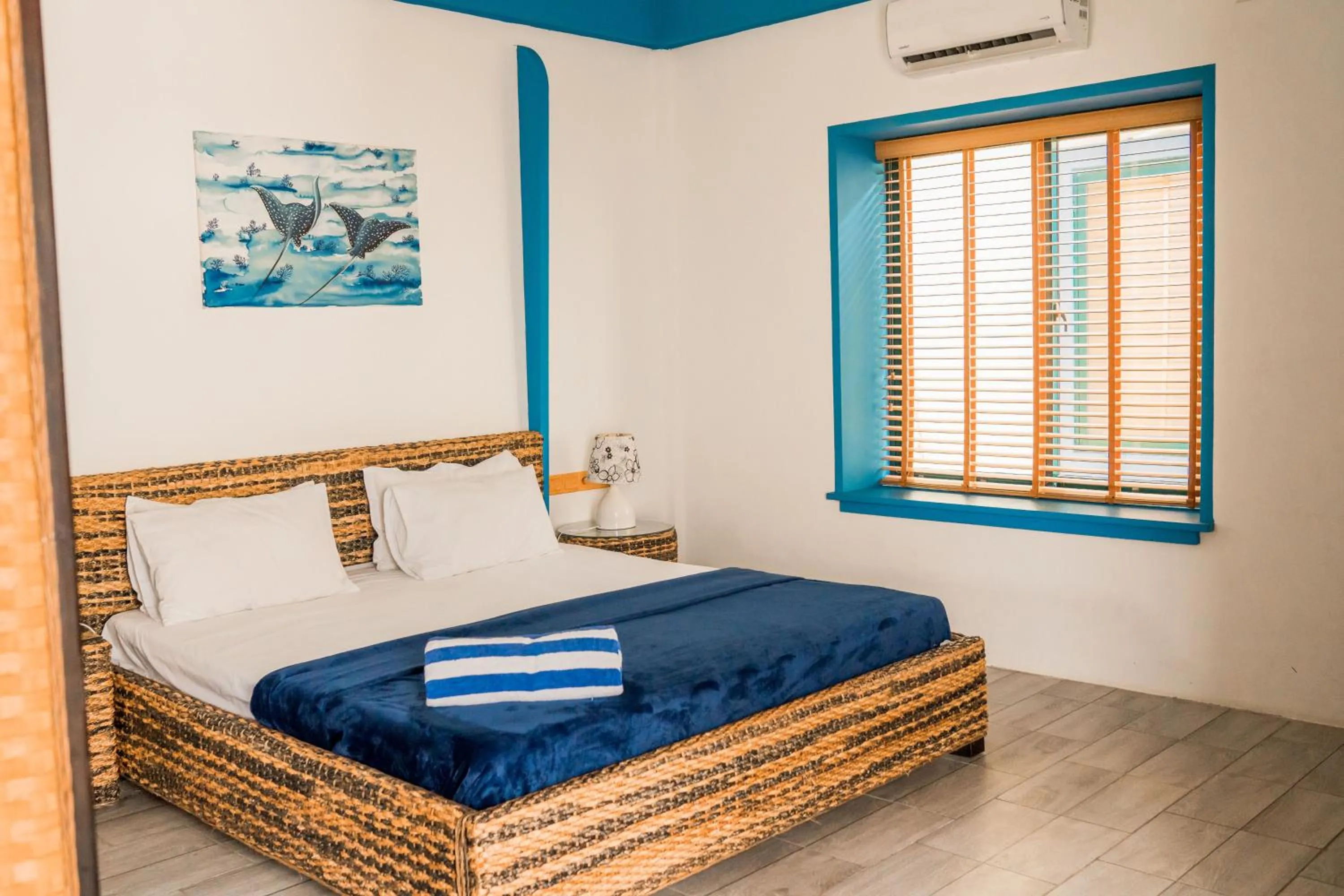 Bedroom in Long Beach Laamu Hotel