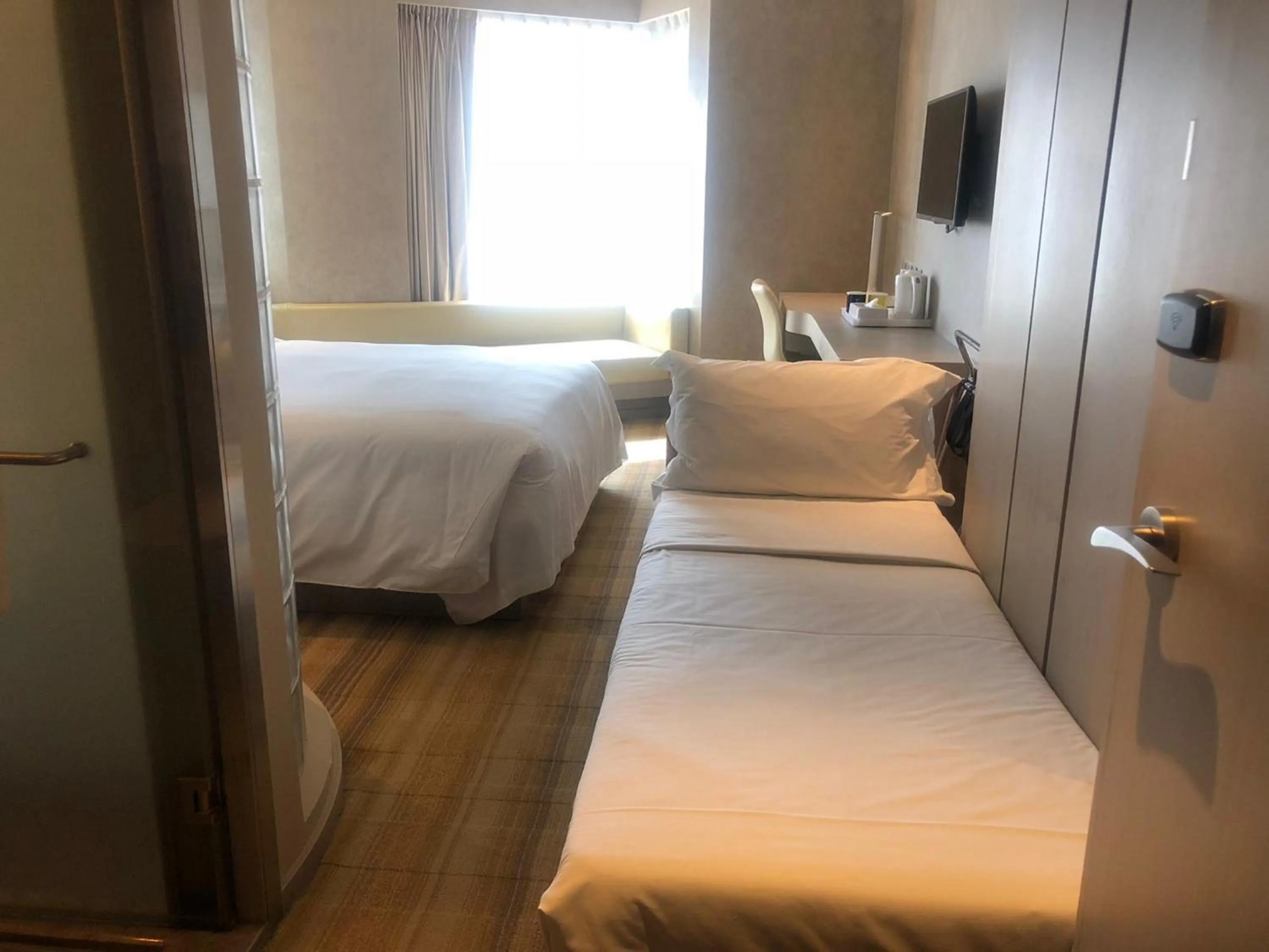 Bed in Holiday Inn Express Hong Kong Mongkok by IHG