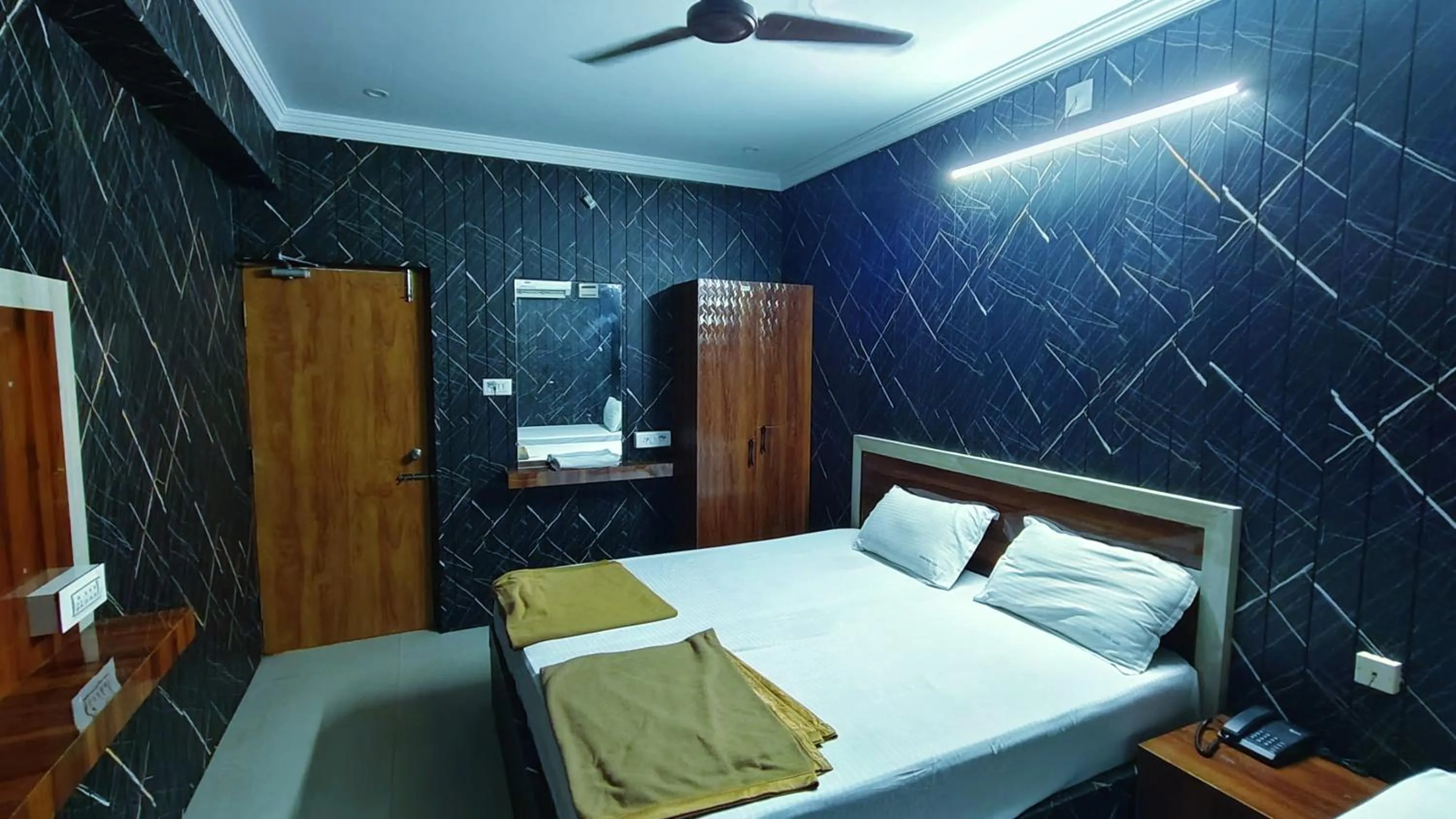 Bed in Hotel Govindh Heights