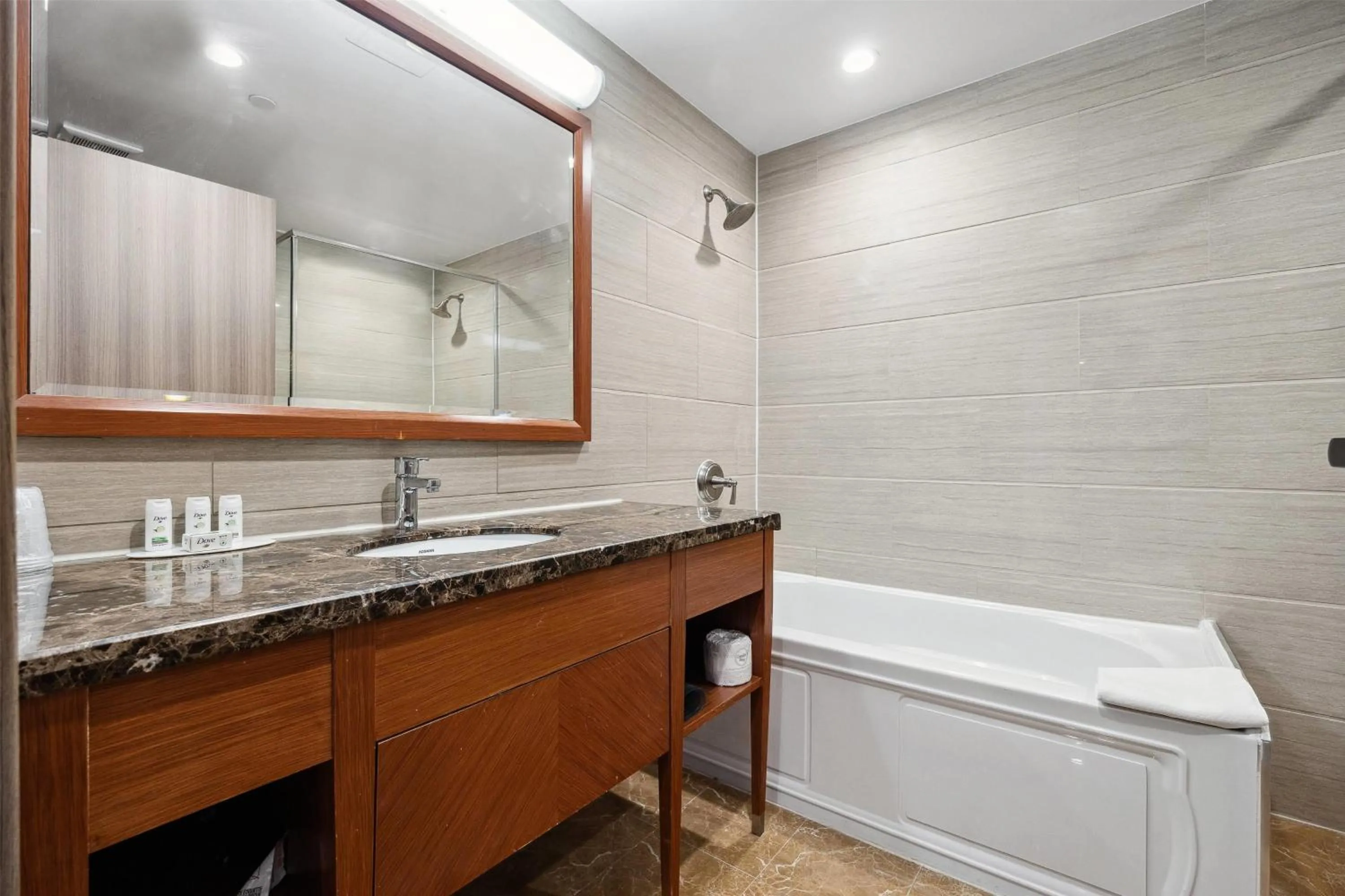 Bathroom in Ramada by Wyndham Flushing Queens
