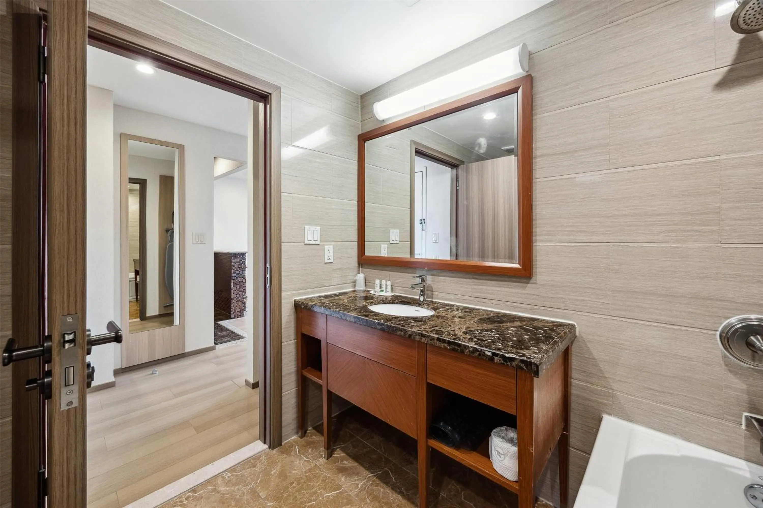 Bathroom in Ramada by Wyndham Flushing Queens