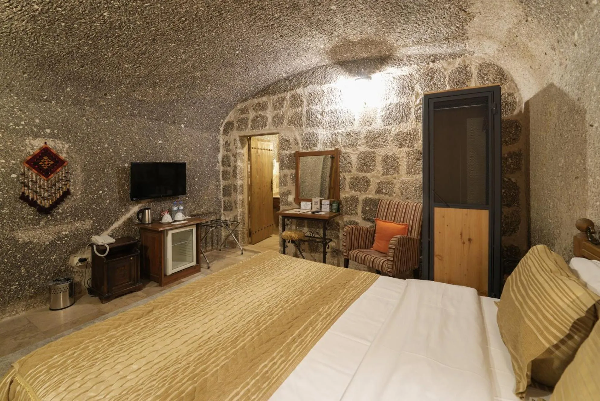 Bed in Tekkaya Cave Hotel