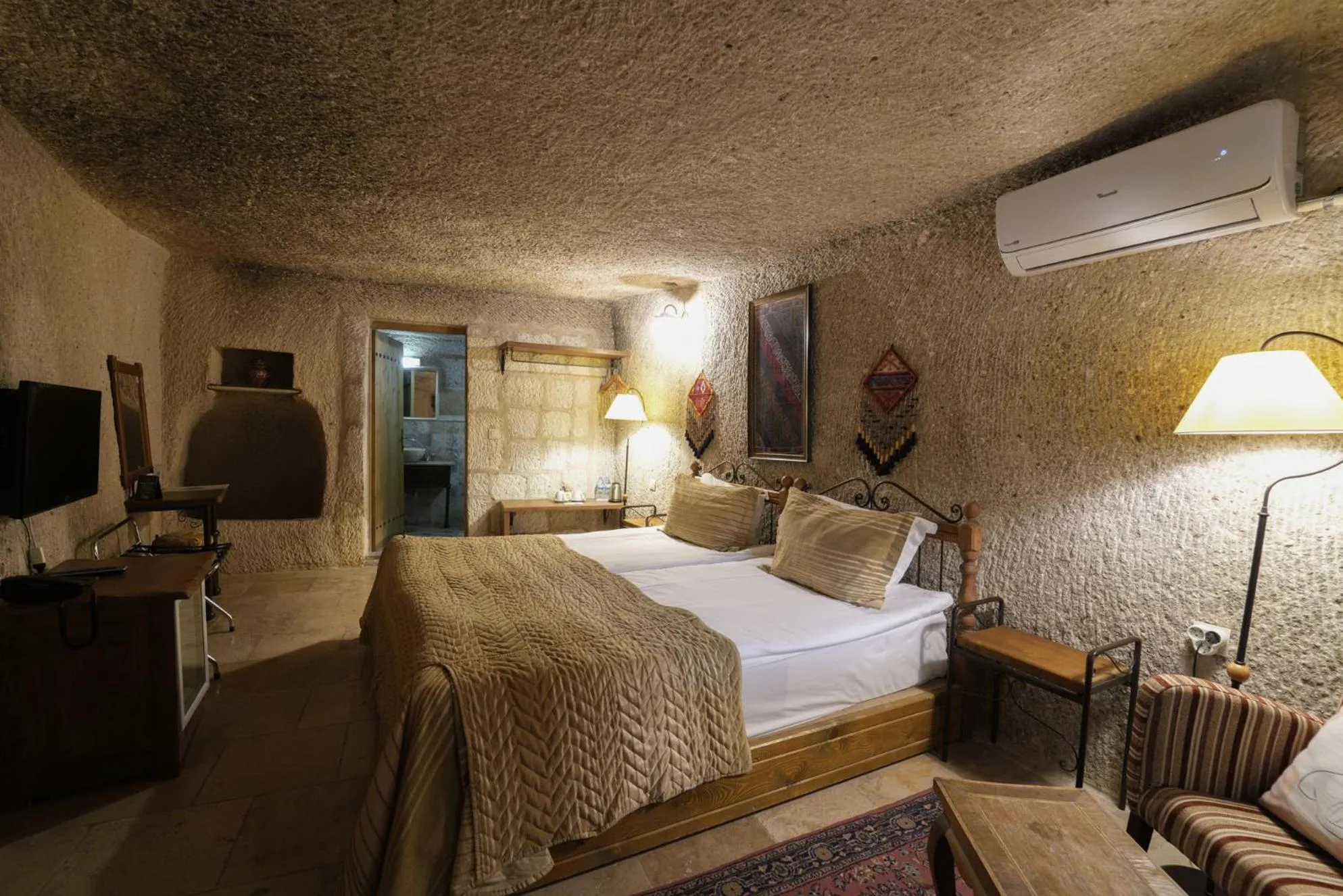 Bed in Tekkaya Cave Hotel