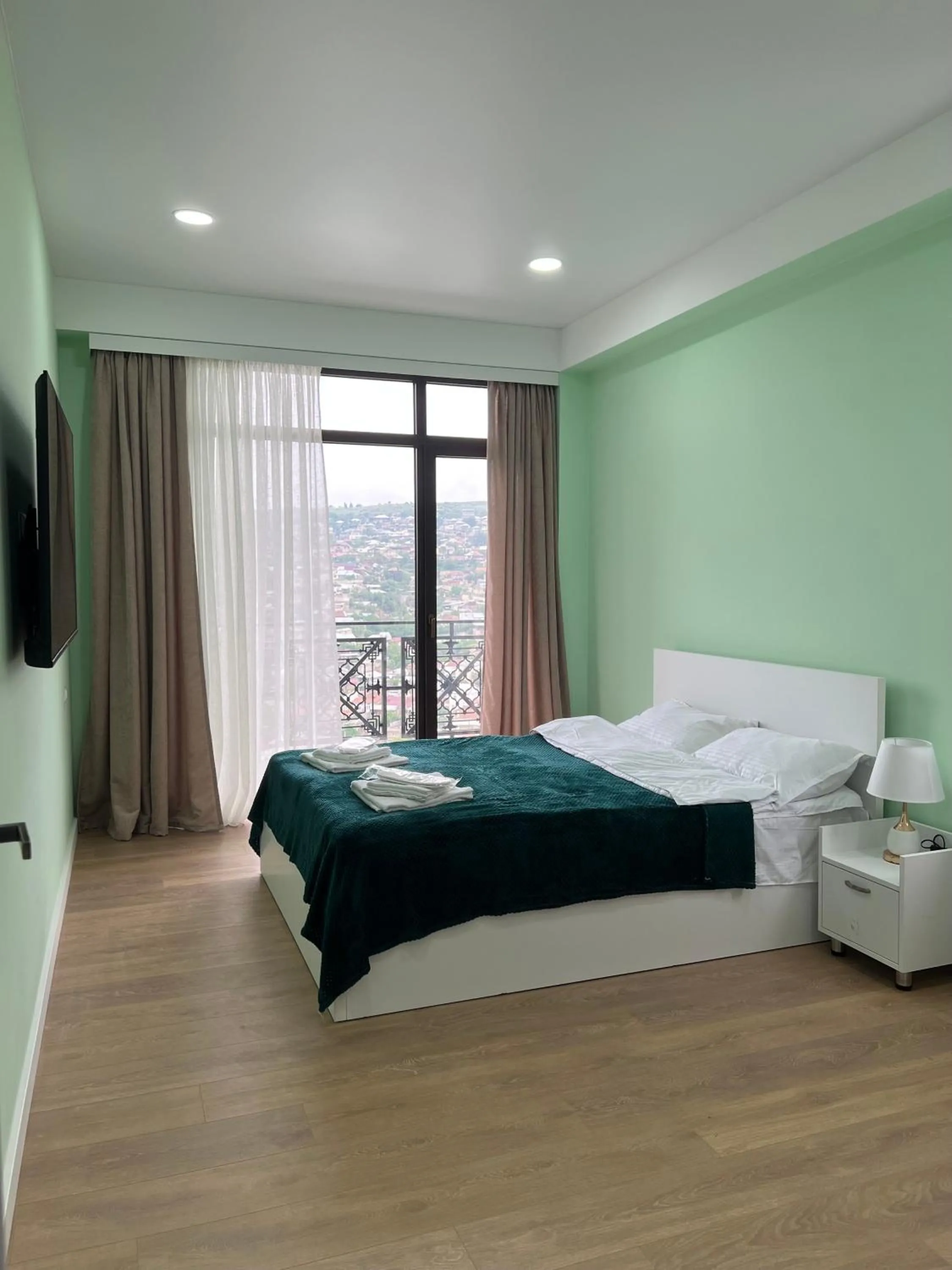 Bed in Panorama Hills Apart-Hotel