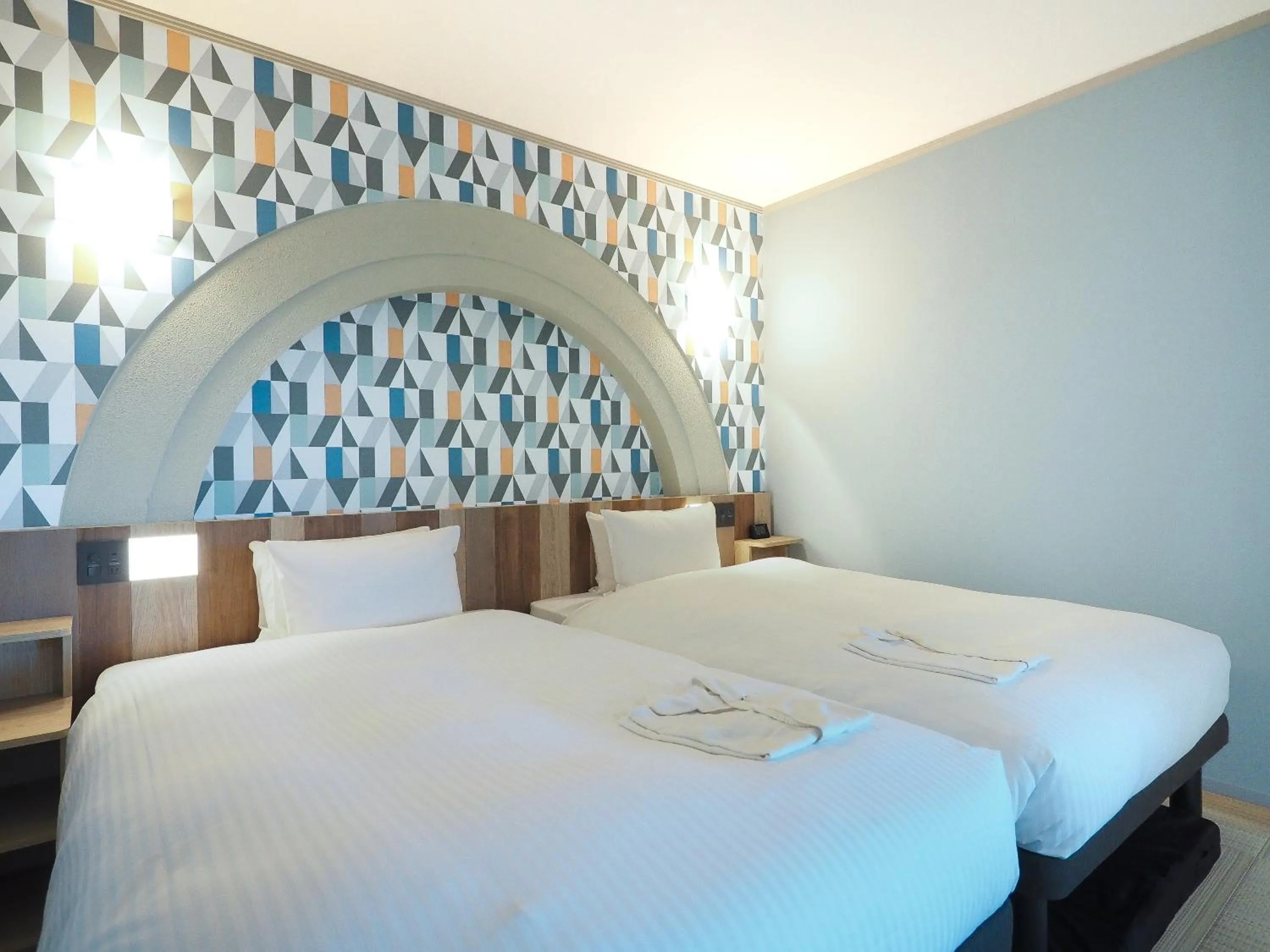 Bed in Hiyori Hotel Osaka Suminoekoen Station