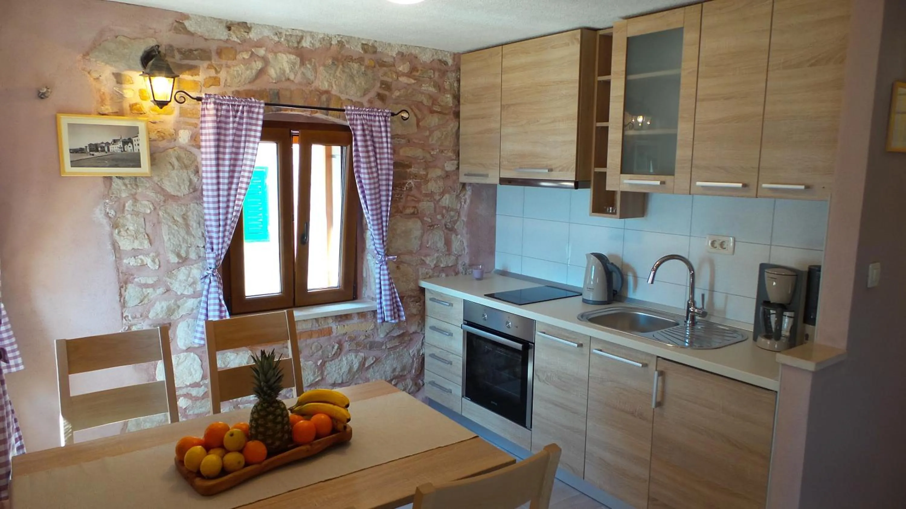Kitchen or kitchenette in Apartments Dvor