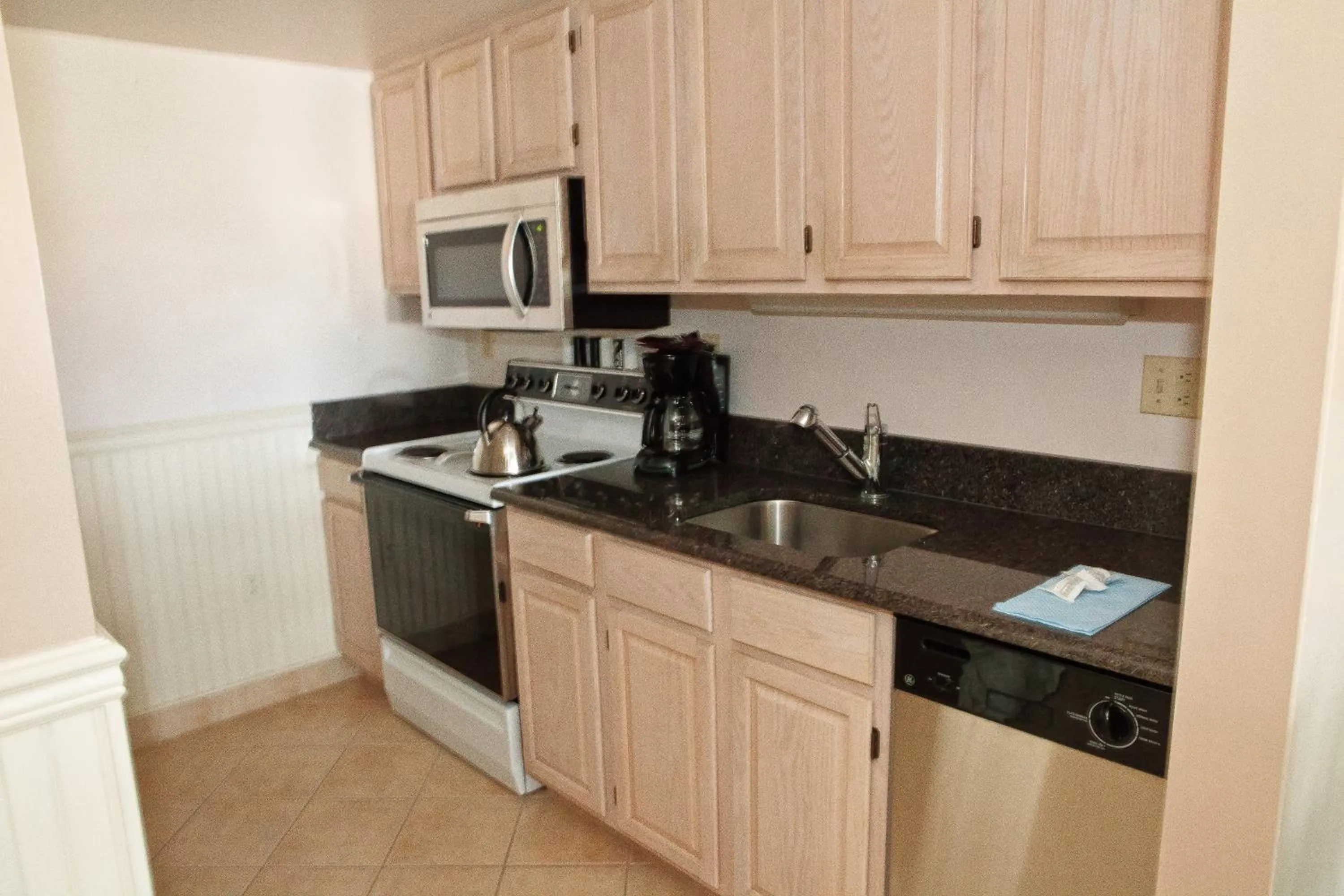 Kitchen or kitchenette in Watson's Regency Suites