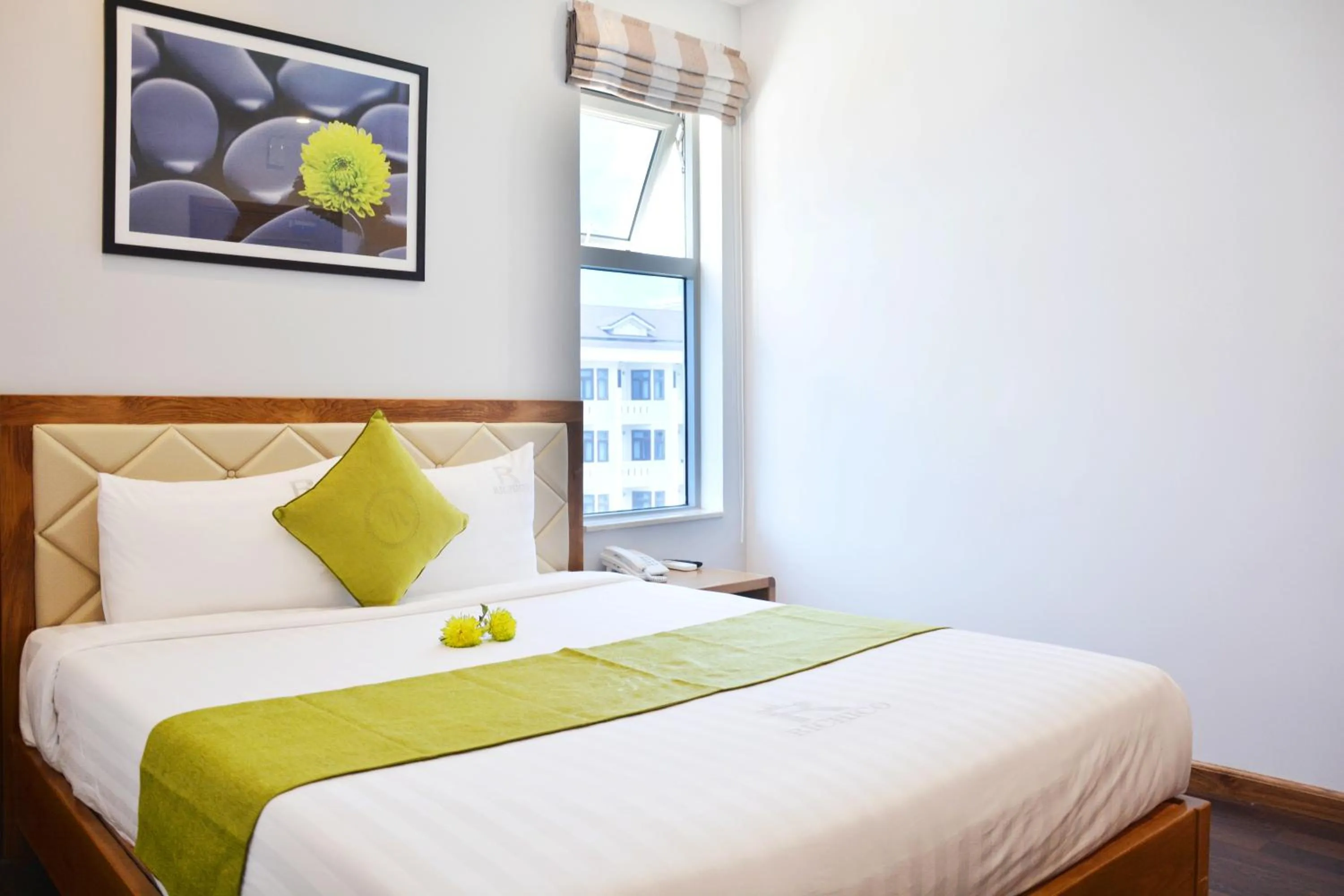 Bed in Richico Apartments And Hotel