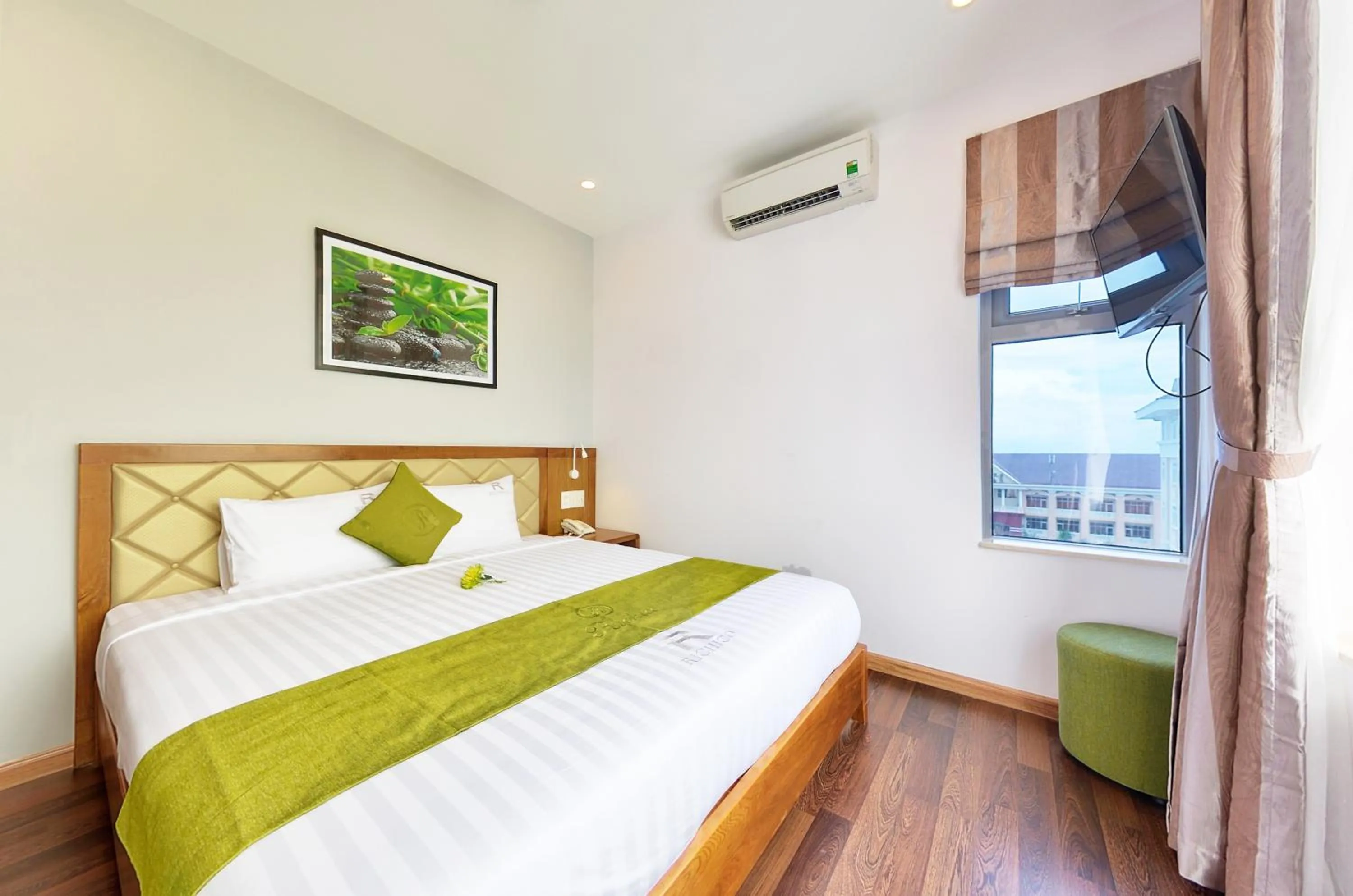 Bed in Richico Apartments And Hotel