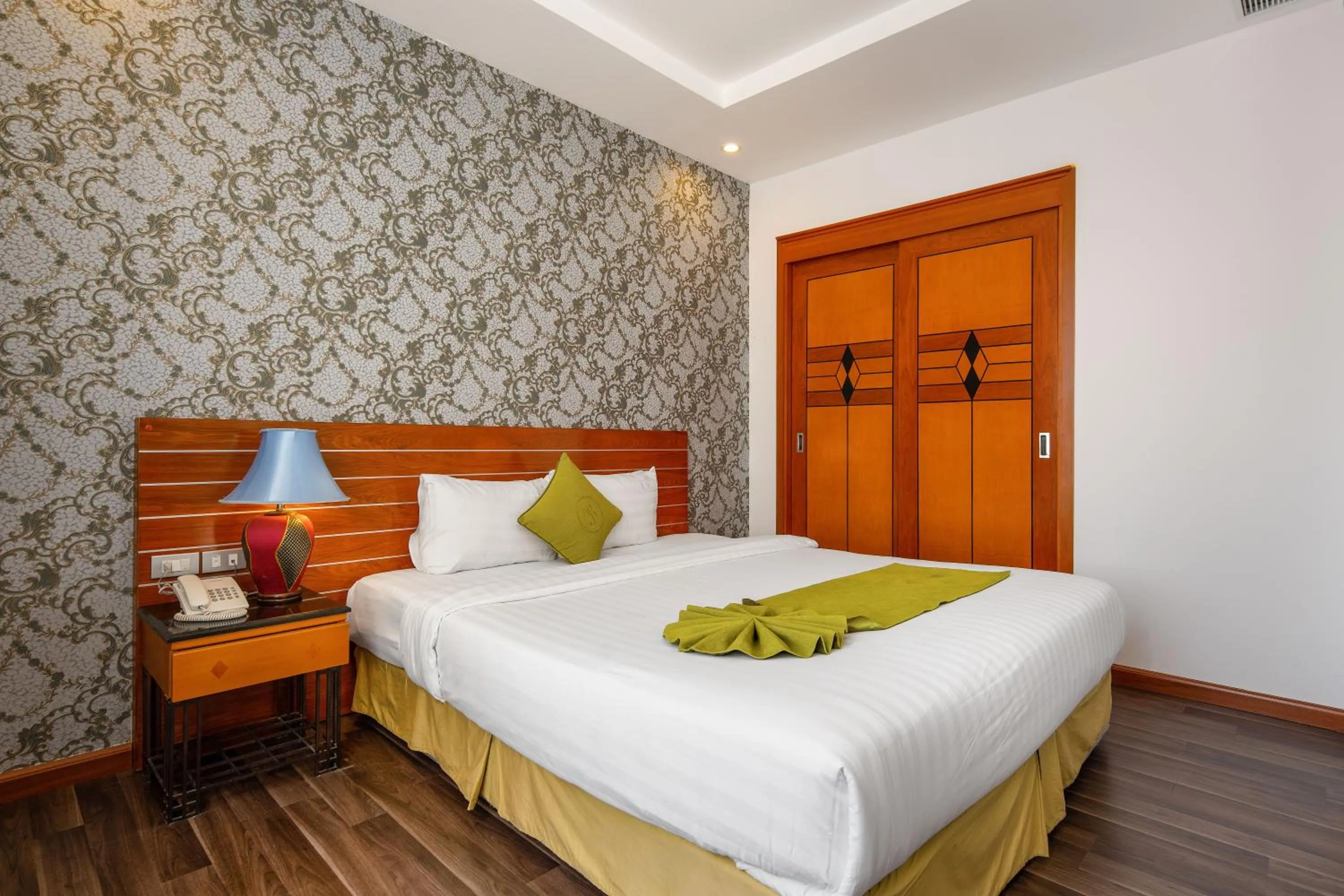 Bed in Richico Apartments And Hotel