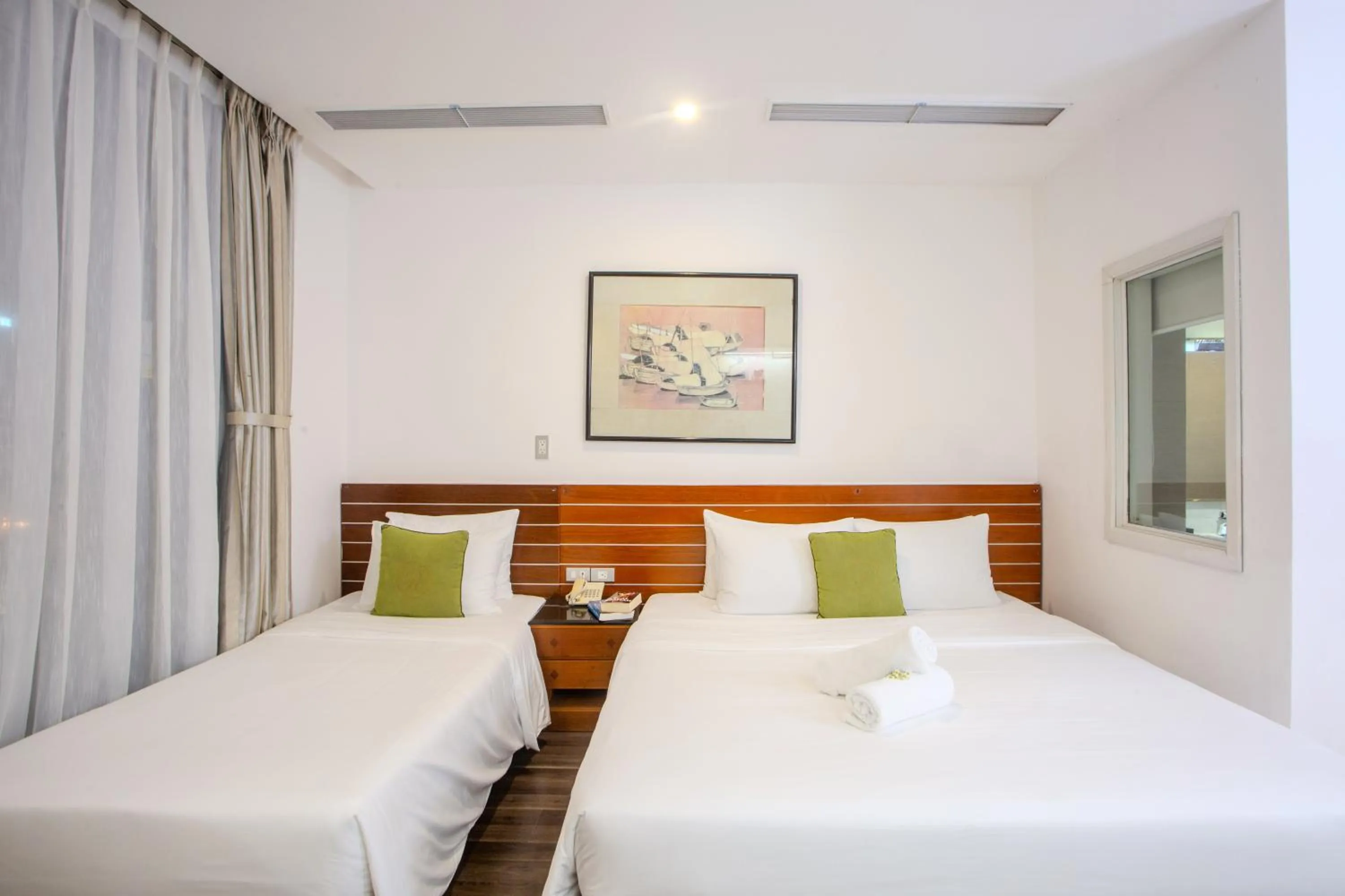 Bed in Richico Apartments And Hotel