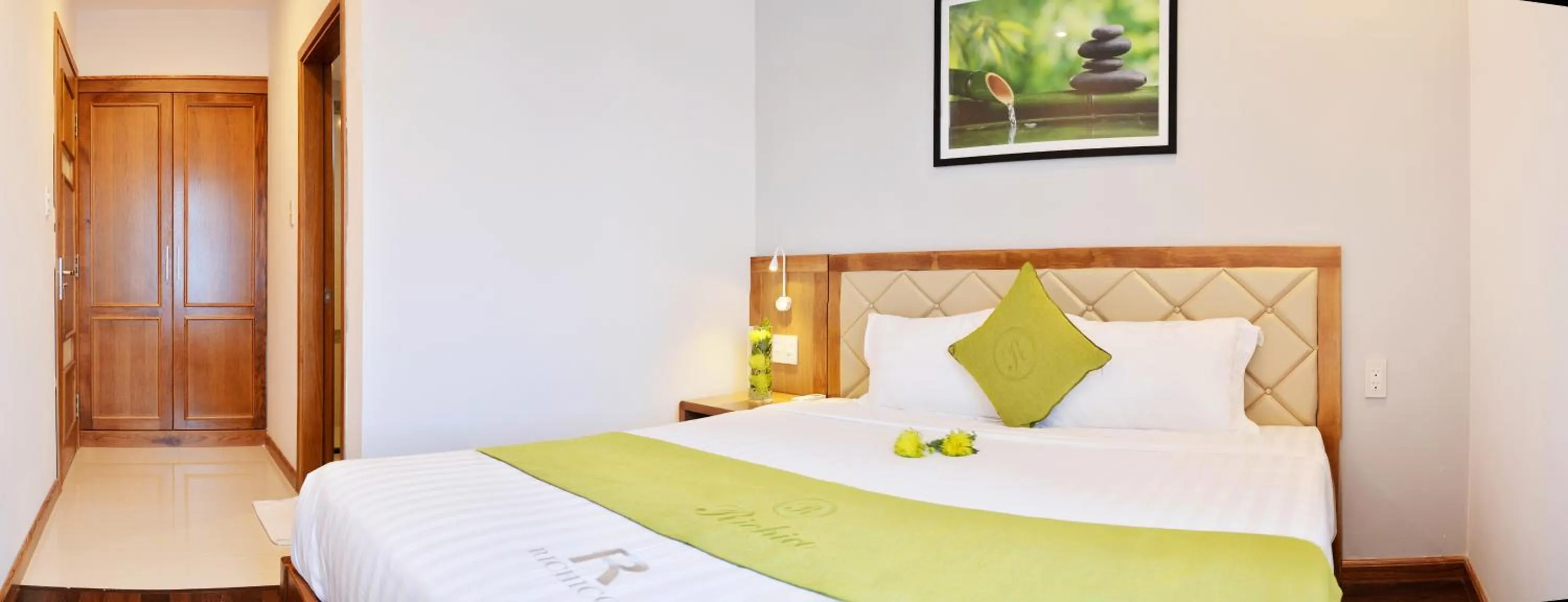 Bed in Richico Apartments And Hotel