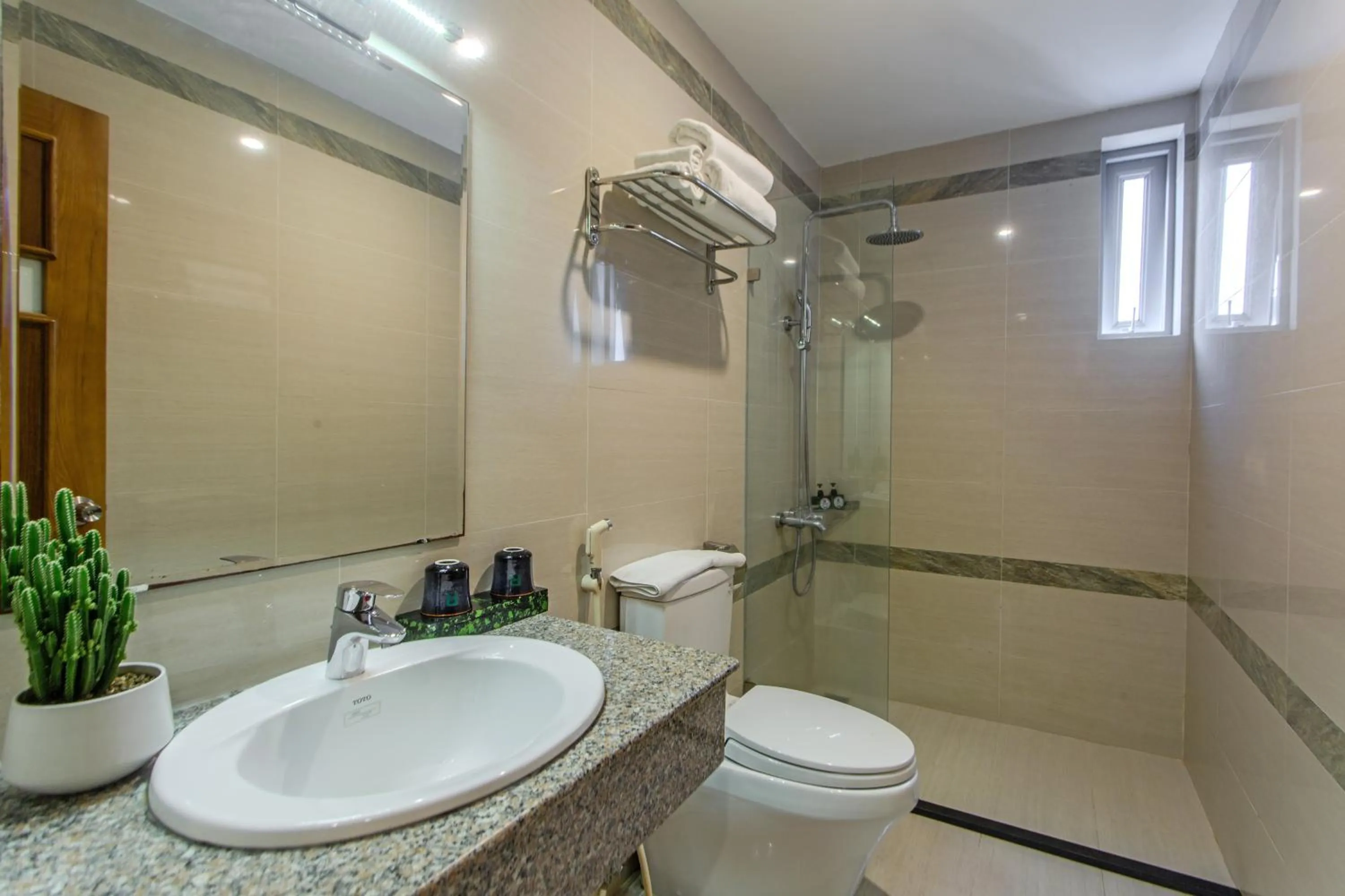 Shower in Richico Apartments And Hotel