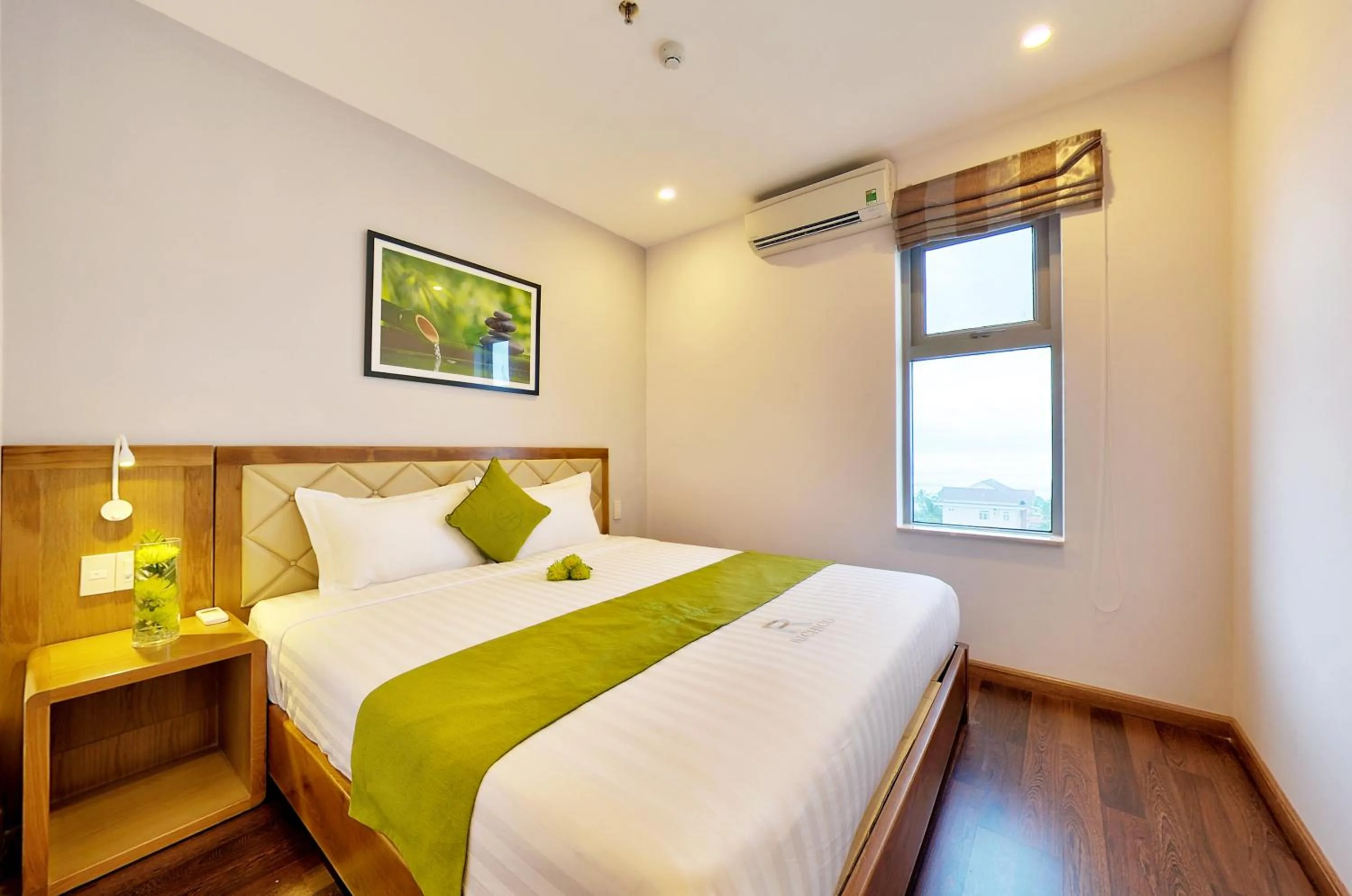 Bed in Richico Apartments And Hotel