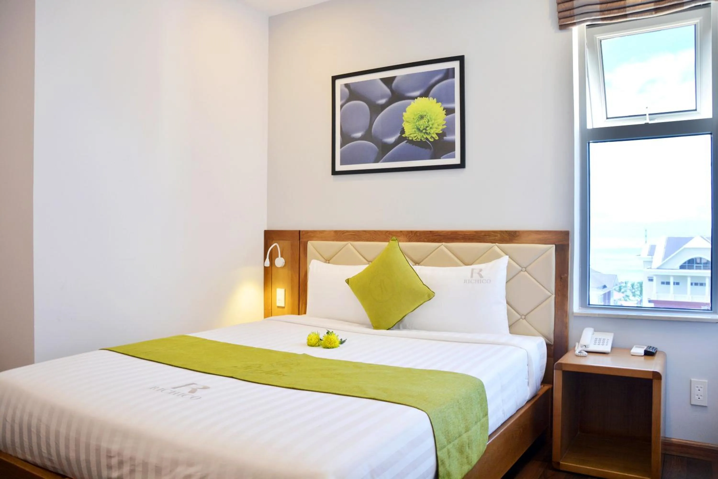 Bed in Richico Apartments And Hotel