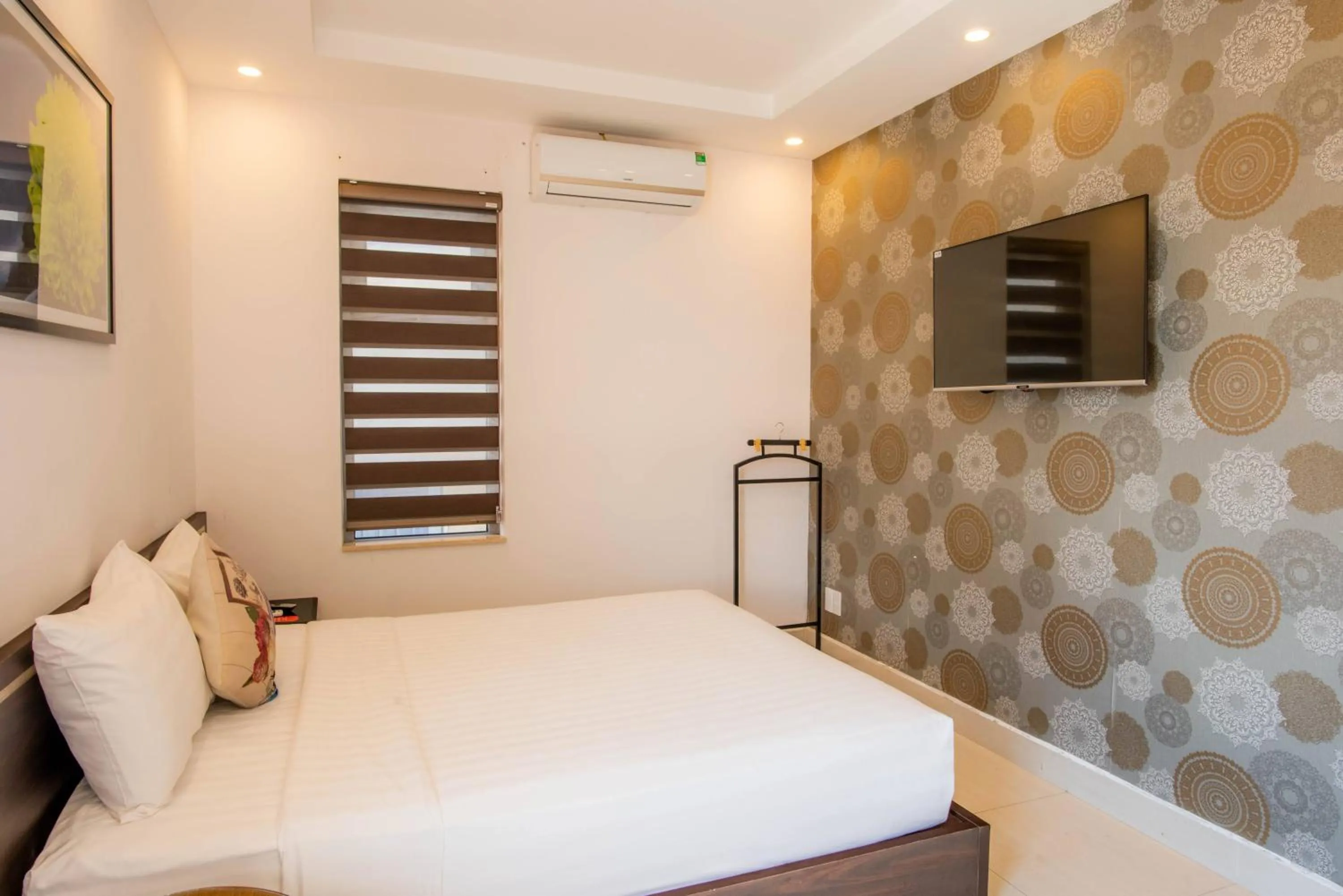 Bed in Richico Apartments And Hotel