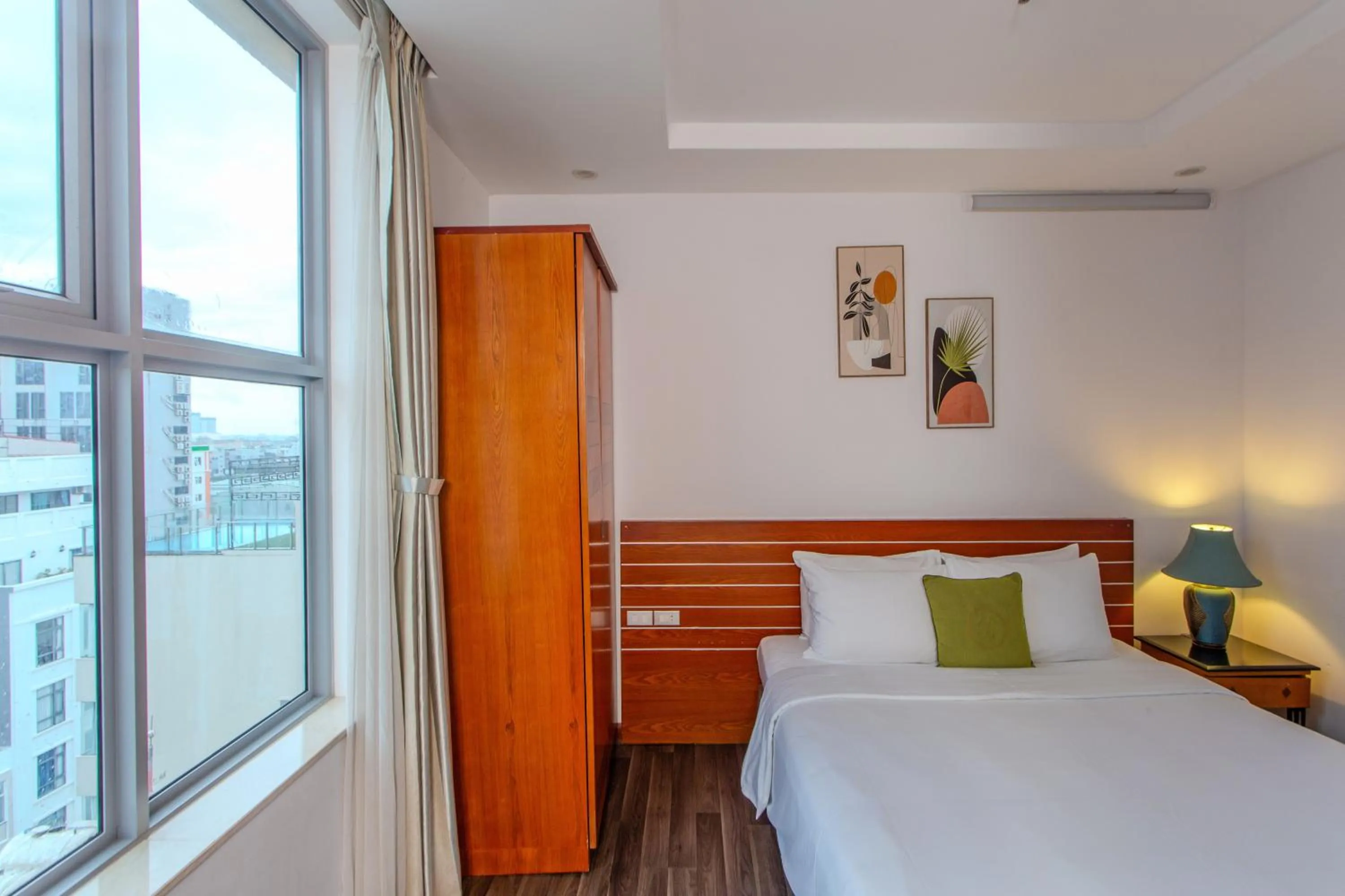 Bed in Richico Apartments And Hotel