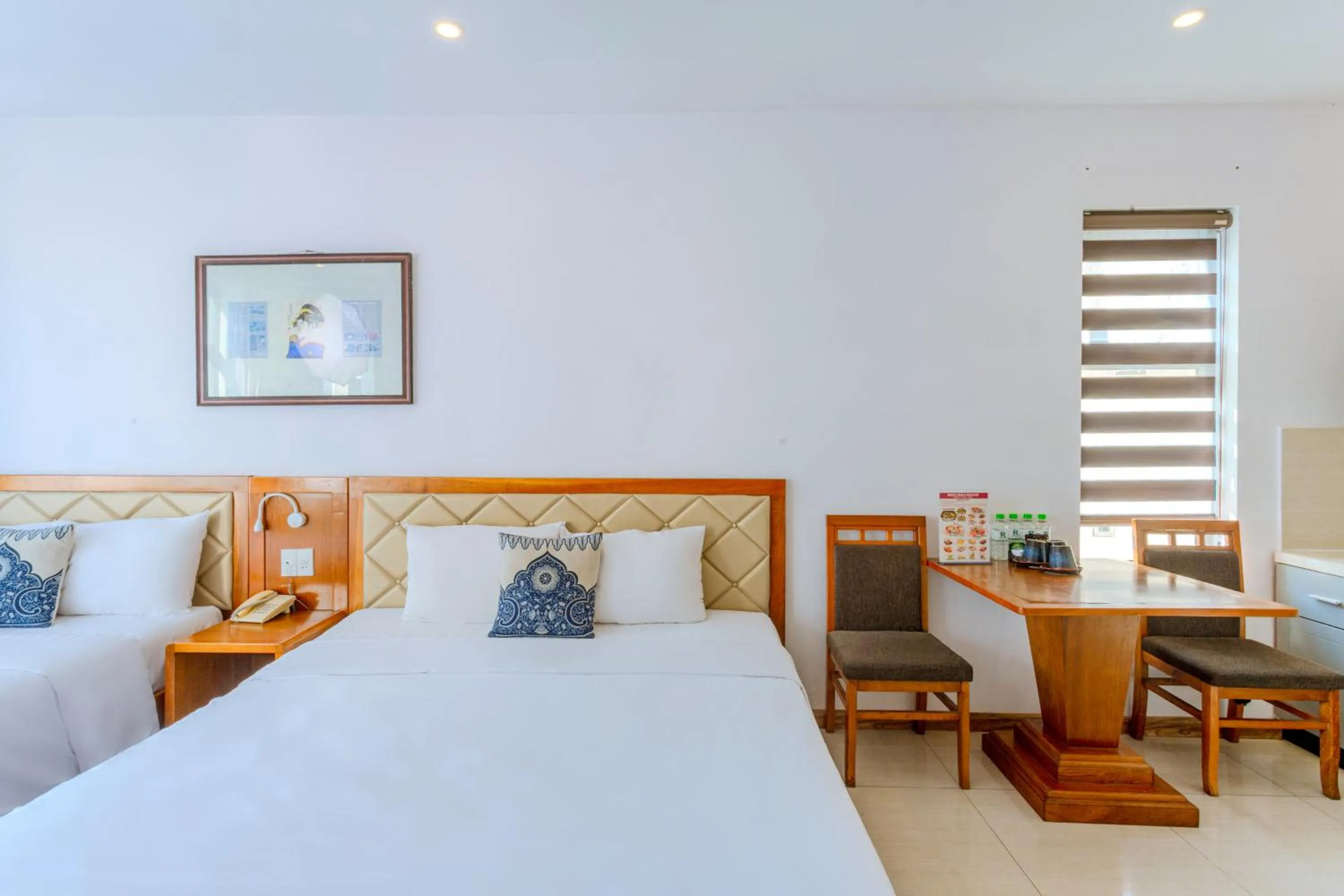 Bed in Richico Apartments And Hotel