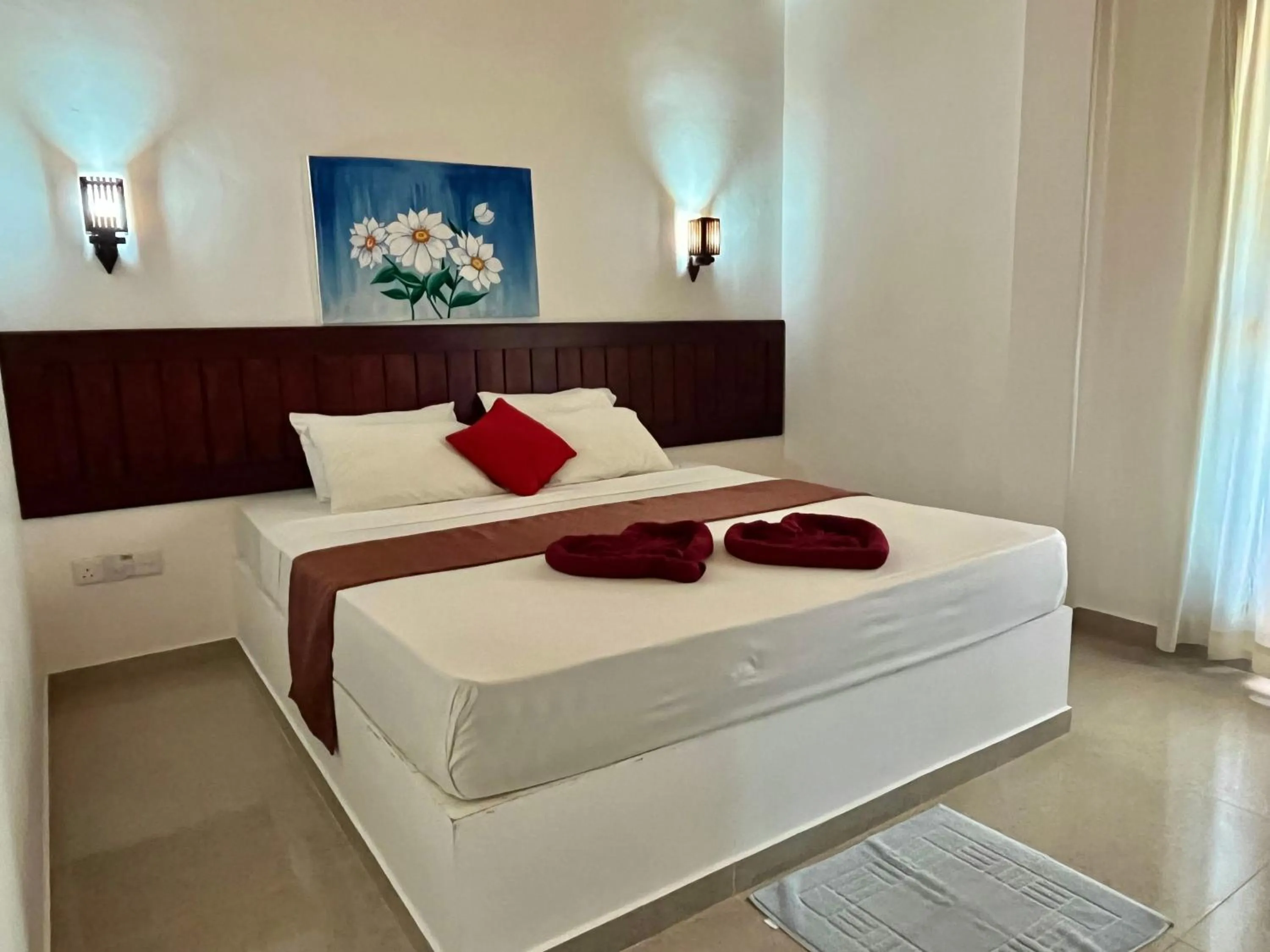 Bed in Sundowners Guesthouse