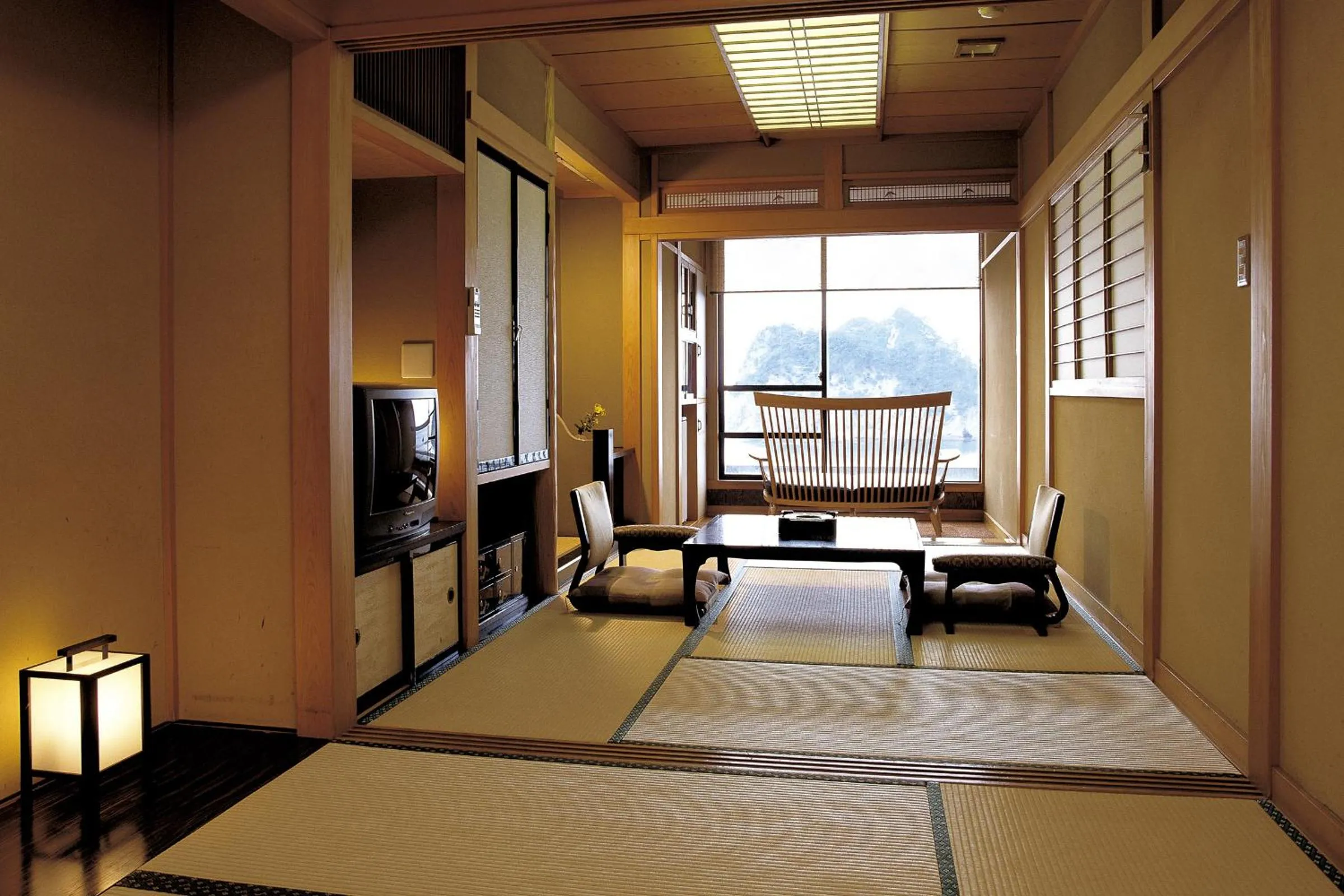 Living room, Bed in UmibenokakureyuSEIRYU海辺のかくれ湯清流