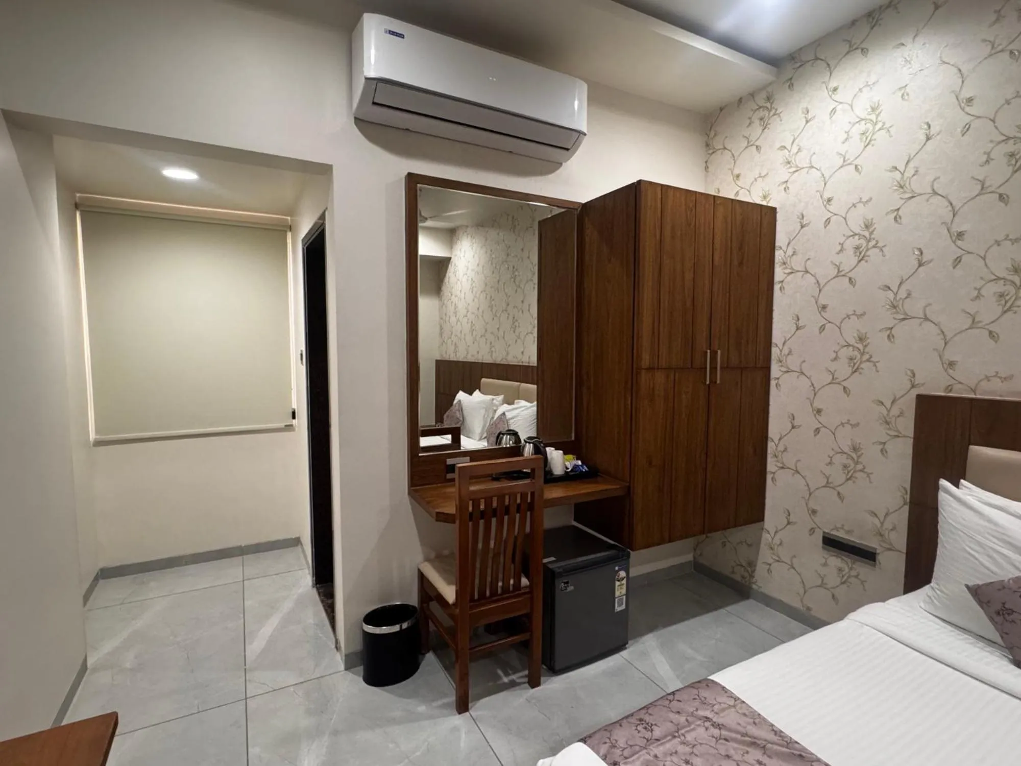 Bed in Pam Premium Hotel Vadodara