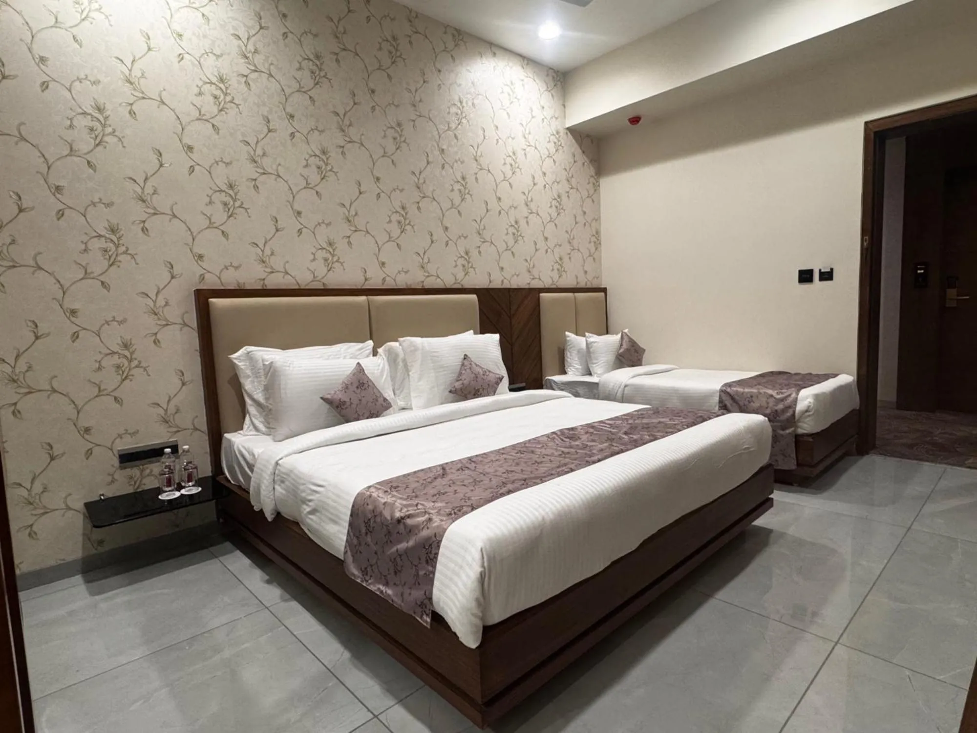 Bed in Pam Premium Hotel Vadodara